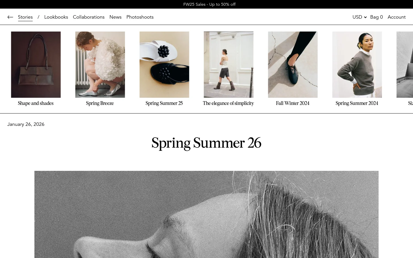 A grid layout on a white background displays various fashion story tiles, each featuring a vertical portrait or product image with a title underneath, such as 'Shape and shades' and 'Spring Breeze'. The navigation menu at the top includes links for Stories, Lookbooks, Collaborations, News, and Photoshoots. A large hero image of a woman's profile in black and white dominates the lower portion of the screen.