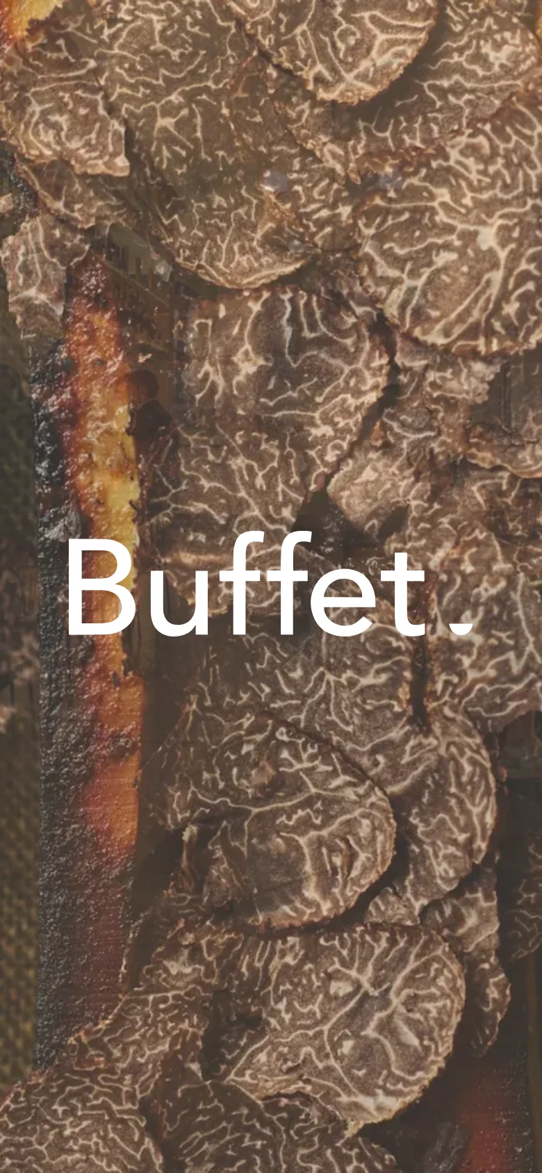 The mobile version presents a vertically stacked layout with a close-up, high-impact hero image of textured food or ingredients. The 'Buffet.' branding remains prominent in white text over the imagery, and the navigation is condensed for a smaller screen.
