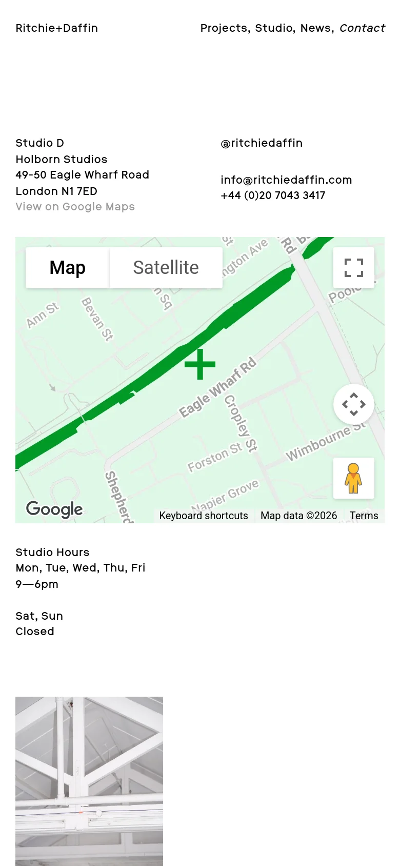 The mobile version uses a single-column vertical layout. The contact information and studio hours are stacked at the top, followed by a full-width Google Map, and ending with the grayscale architectural image at the bottom.