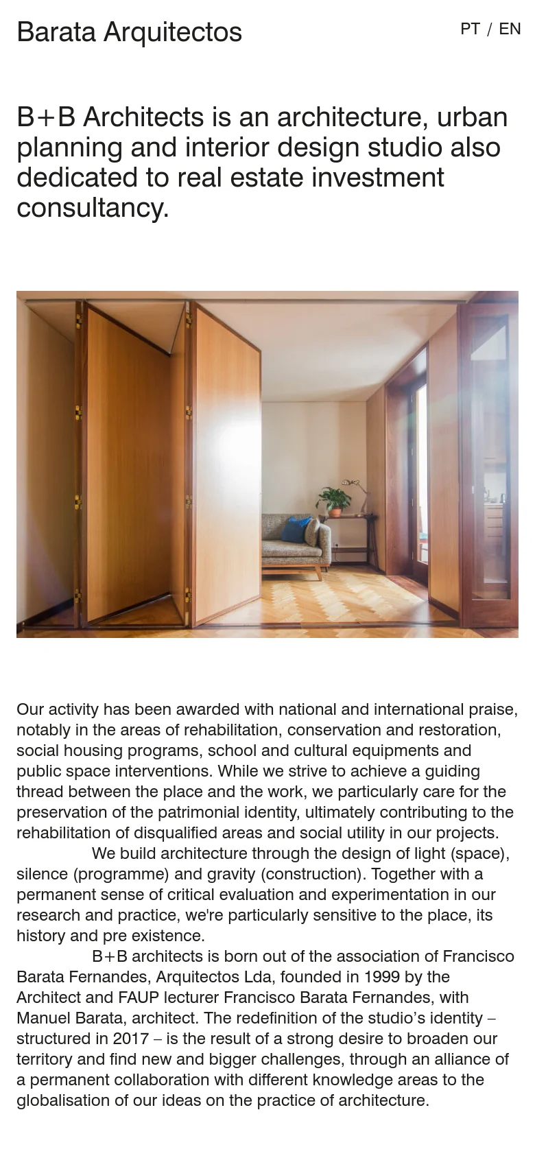 The mobile version uses a single-column vertical stack, placing the studio name and mission statement at the top. The large interior photograph is positioned below the introductory text, and the contact and team details follow at the bottom of the scroll. The layout is simplified for vertical reading, maintaining the clean white and black aesthetic.