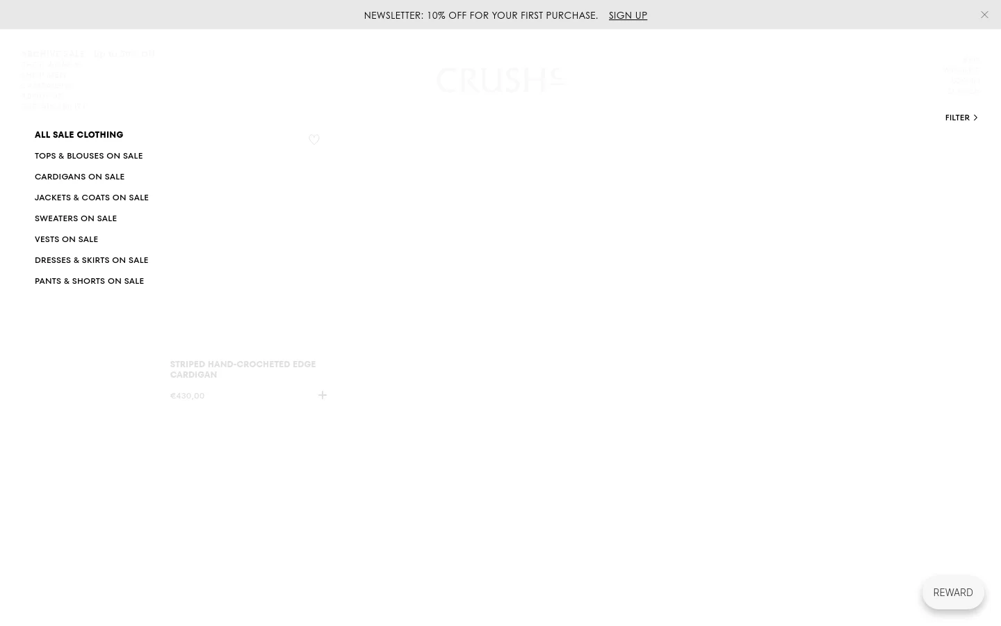 The desktop view of the Archive Sale page features a minimalist white layout with the CRUSH logo centered at the top. A left-hand sidebar provides navigation links to various sale categories like Tops, Cardigans, and Dresses, while the main content area displays a product grid with large product images, titles, and prices. A top banner offers a 10% discount for newsletter signups.