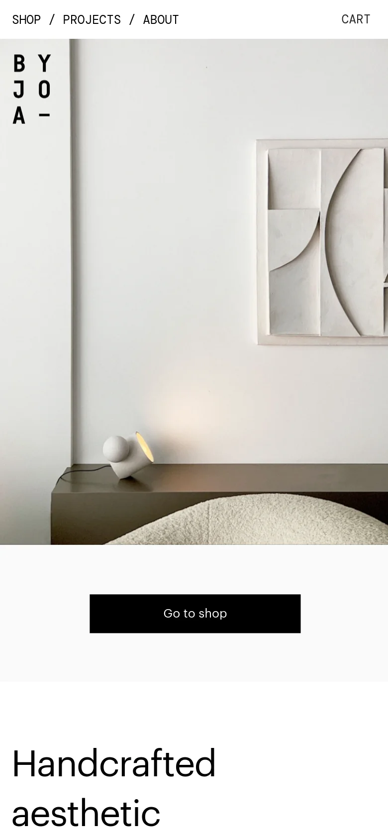 The mobile version presents a vertically stacked layout, starting with the brand logo and navigation menu at the top. A large, high-quality image of ceramic art fills the screen, followed by a prominent black 'Go to shop' button and the headline 'Handcrafted aesthetic'. The design remains clean and minimalist, optimized for vertical scrolling.