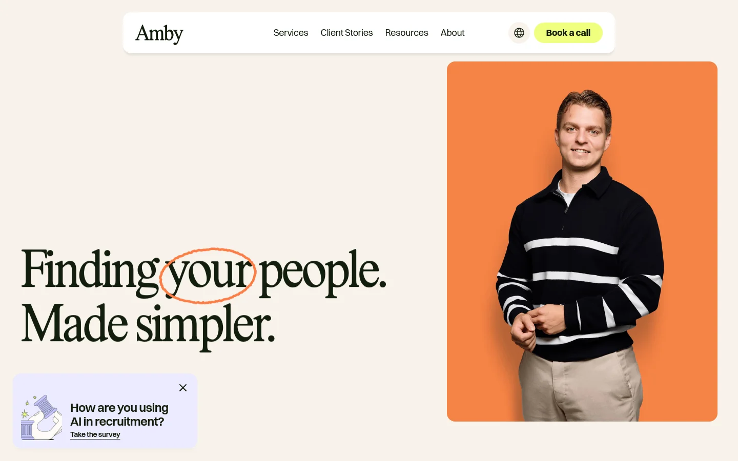 Desktop homepage for Amby featuring a large headline 'Finding your people. Made simpler.' on a cream background. To the right is a portrait of a smiling man in a striped polo against an orange background, and a navigation bar at the top includes links for Services, Client Stories, Resources, and About, alongside a 'Book a call' button. A small pop-up survey about AI in recruitment appears in the bottom left corner.
