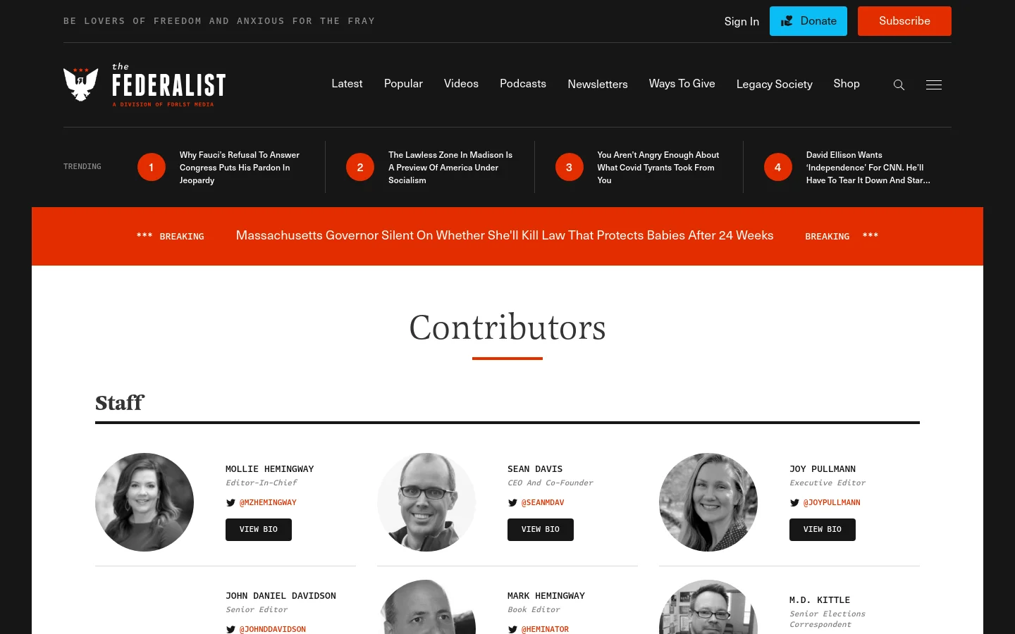 The Contributors page features a clean white background with a centered 'Contributors' headline and a red underline. Below a 'Staff' heading, a grid layout displays circular headshots of editors alongside their names, titles, Twitter handles, and black 'VIEW BIO' buttons. The top navigation bar is dark with white text, featuring the Federalist logo, search icon, and orange 'Subscribe' button.