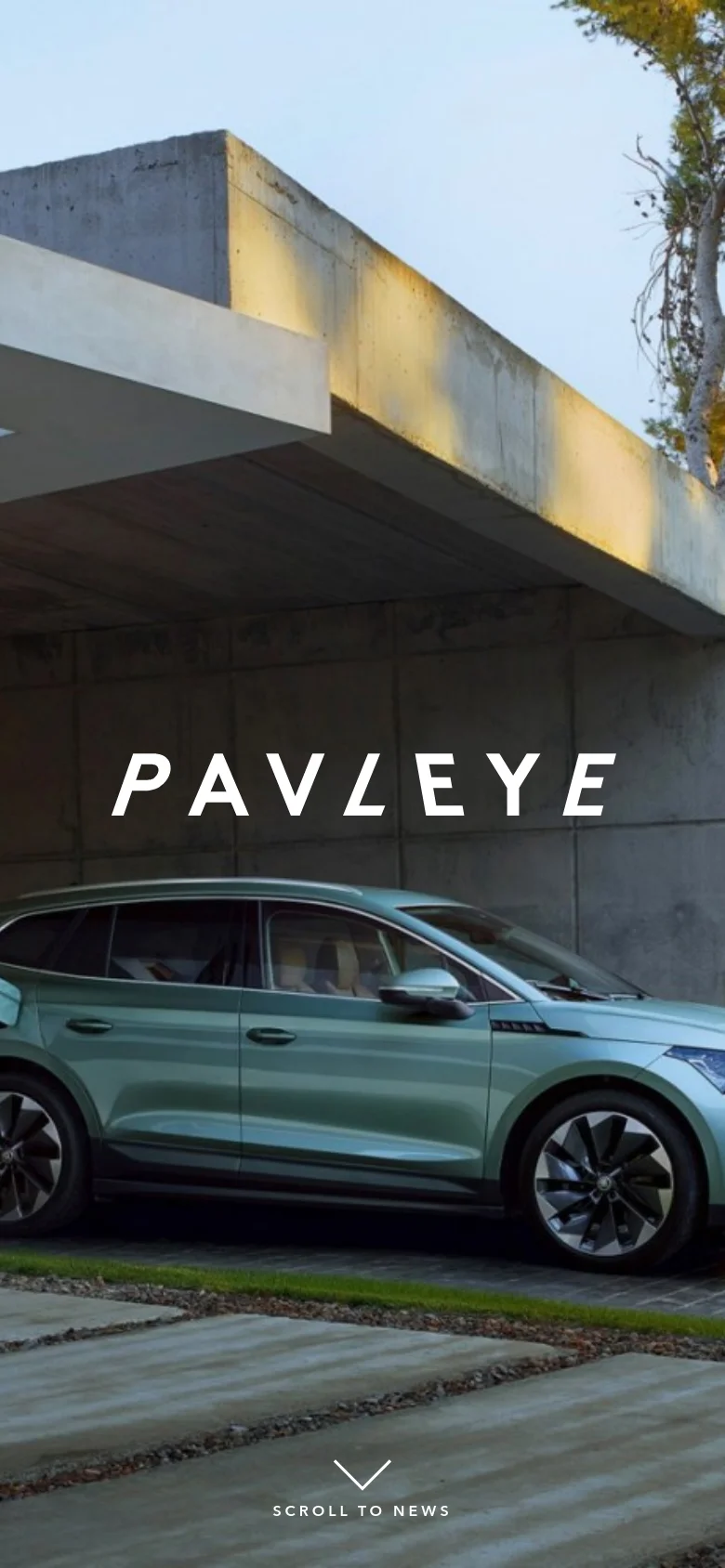 The mobile version presents a vertically oriented hero image focusing on the front half of a light green car parked under a concrete architectural structure. The white 'PAVLEYE' logo is centered over the car, and a 'SCROLL TO NEWS' arrow icon is positioned at the bottom of the screen.