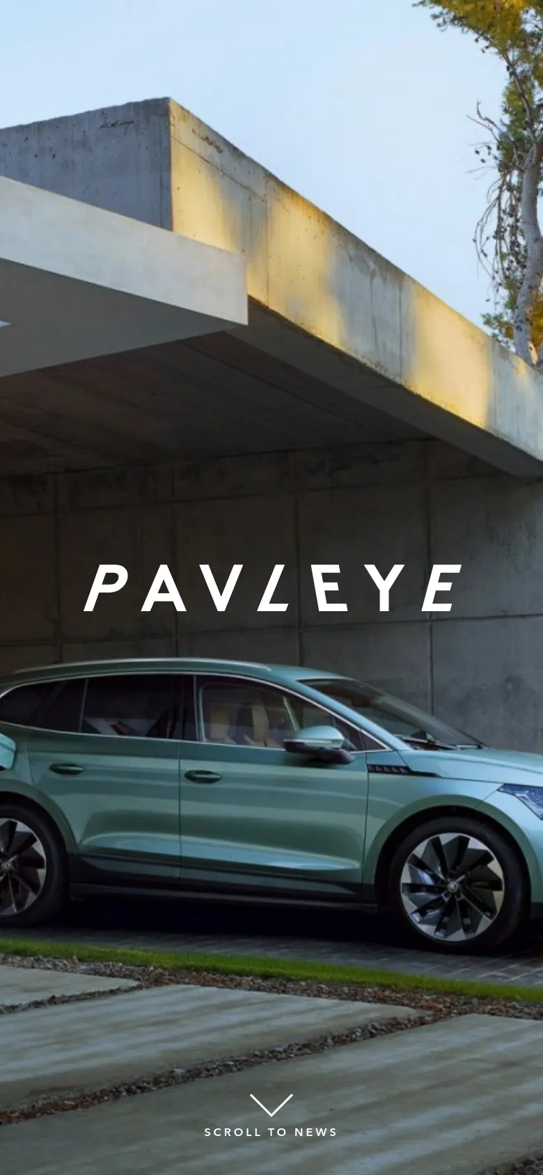 The mobile version presents a vertically oriented hero image focusing on the front half of a light green car parked under a concrete architectural structure. The white 'PAVLEYE' logo is centered over the car, and a 'SCROLL TO NEWS' arrow icon is positioned at the bottom of the screen.
