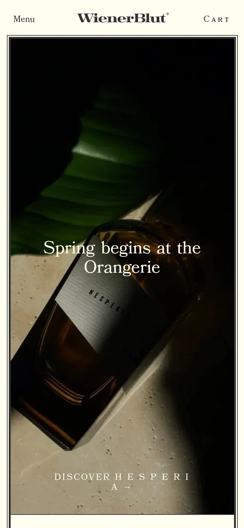 The mobile version presents a vertically oriented, full-screen hero image of the perfume bottle with the same dark, atmospheric aesthetic. The headline 'Spring begins at the Orangerie' and the 'DISCOVER HESPERIA' link are centered, while the navigation is condensed into a 'Menu' button on the left and 'CART' on the right.