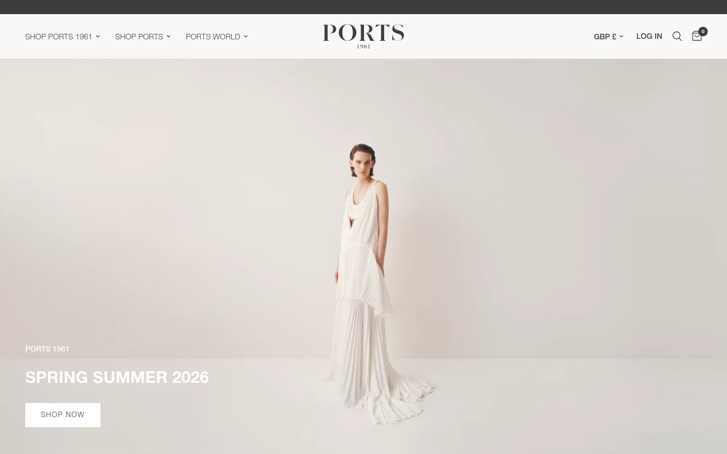 The desktop website features a minimalist white header with the PORTS 1961 logo centered and navigation menus on the left. A large hero image shows a model in a flowing white pleated dress against a neutral background, with the headline 'SPRING SUMMER 2026' and a white 'SHOP NOW' button.