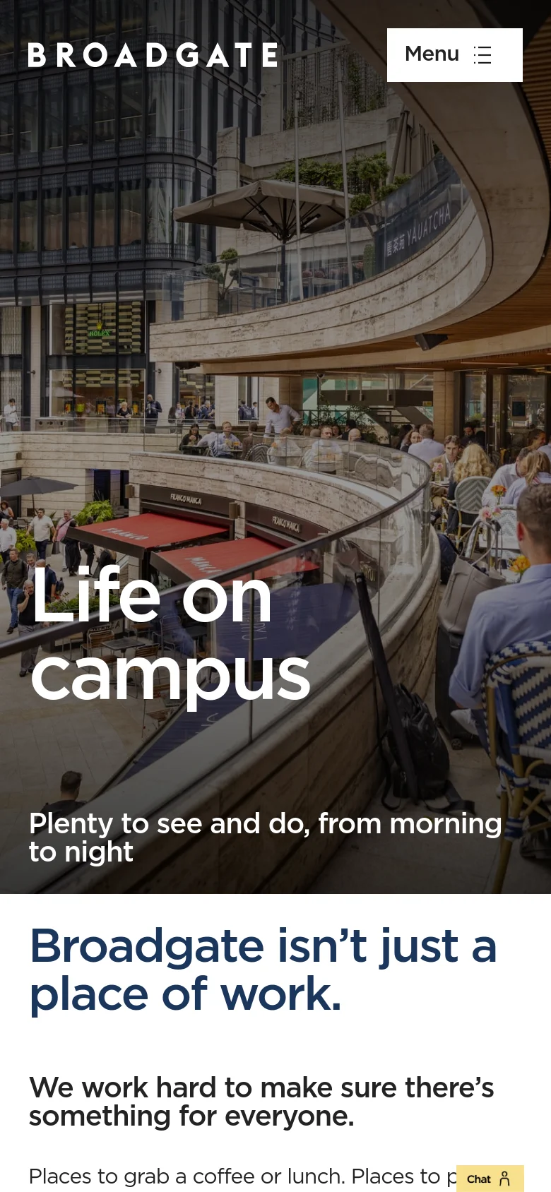 The mobile version presents a vertically stacked layout with the hero image occupying the top half of the screen. The navigation is condensed into a white 'Menu' button with a hamburger icon in the top right corner. The headline 'Life on campus' and subtext are centered over the image, and a yellow 'Chat' button is anchored to the bottom right.