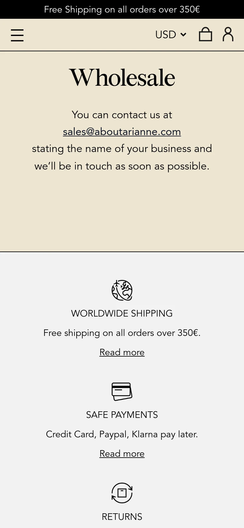 The mobile version presents a simplified vertical layout on a cream background, centered around the 'Wholesale' heading and contact email. The navigation is condensed into a hamburger menu icon at the top left, while the service highlights for shipping, payments, and returns are stacked vertically with 'Read more' links under each. The overall aesthetic remains clean and minimalist with high-contrast black text.