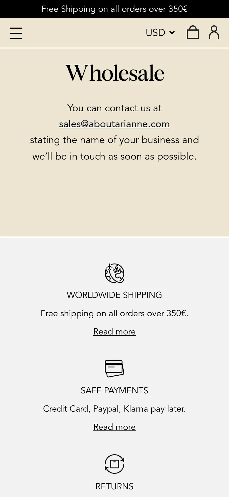 The mobile version presents a simplified vertical layout on a cream background, centered around the 'Wholesale' heading and contact email. The navigation is condensed into a hamburger menu icon at the top left, while the service highlights for shipping, payments, and returns are stacked vertically with 'Read more' links under each. The overall aesthetic remains clean and minimalist with high-contrast black text.