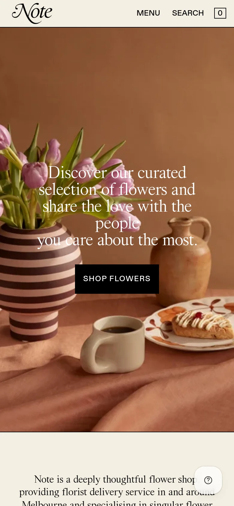 The mobile version presents a vertically stacked layout with the same warm-toned floral hero imagery and centered text. The navigation is condensed into a 'MENU' link, a 'SEARCH' option, and a shopping bag icon. The hero section occupies the full width of the screen, emphasizing the large typography and 'SHOP FLOWERS' button.