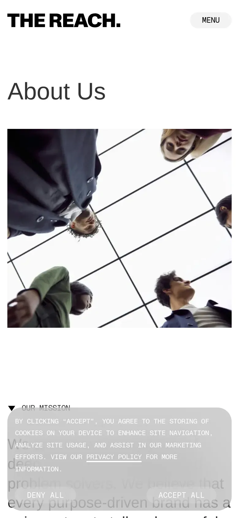 The mobile version simplifies the layout, replacing the top navigation bar with a single 'MENU' button next to the logo. The 'About Us' headline is positioned above the hero image, which shows a vertical crop of the people looking up through the glass ceiling. The cookie consent banner appears as a large overlay at the bottom of the screen.