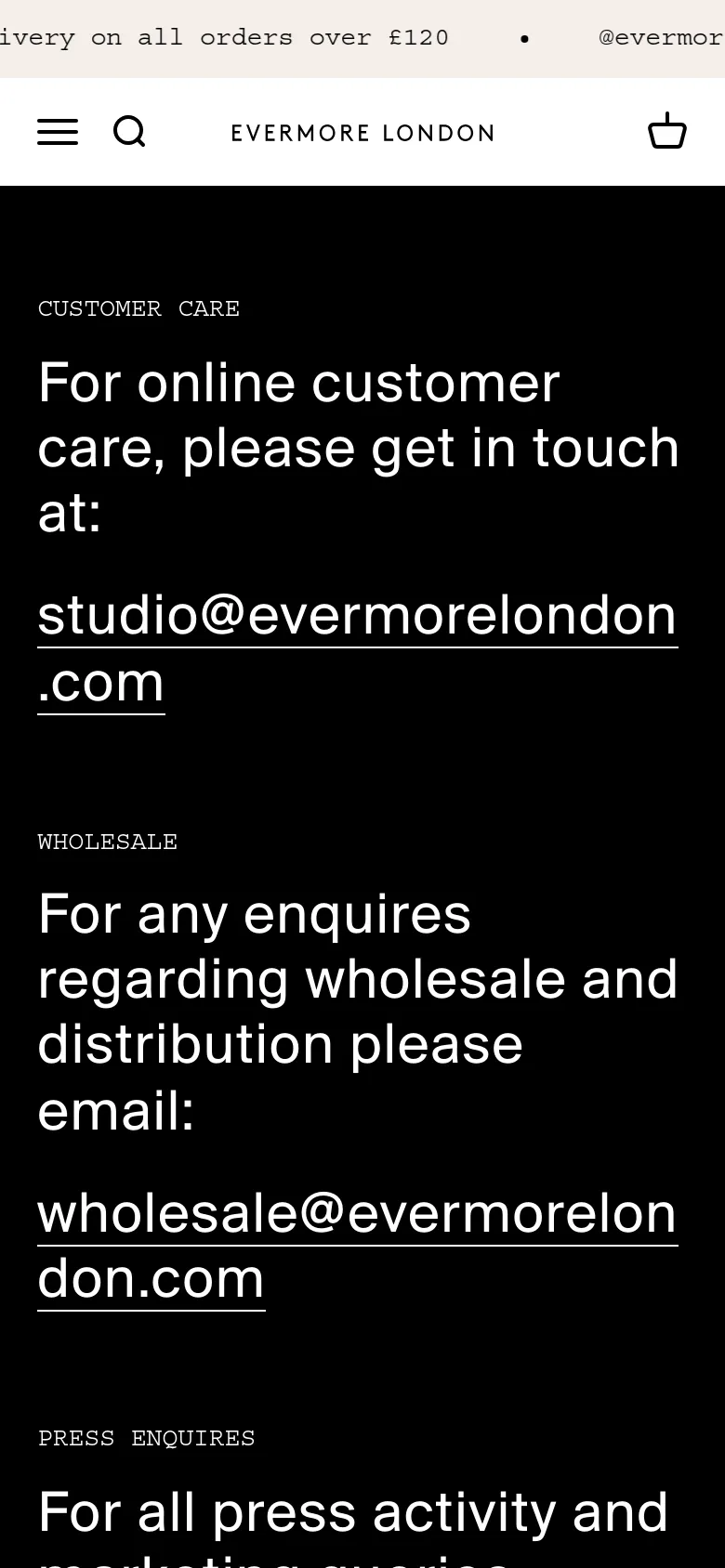 The mobile version maintains the black background and white text but uses a single-column vertical layout for easier scrolling. The navigation is condensed into a hamburger menu and search icon at the top, and the contact email addresses are stacked vertically under their respective headings.
