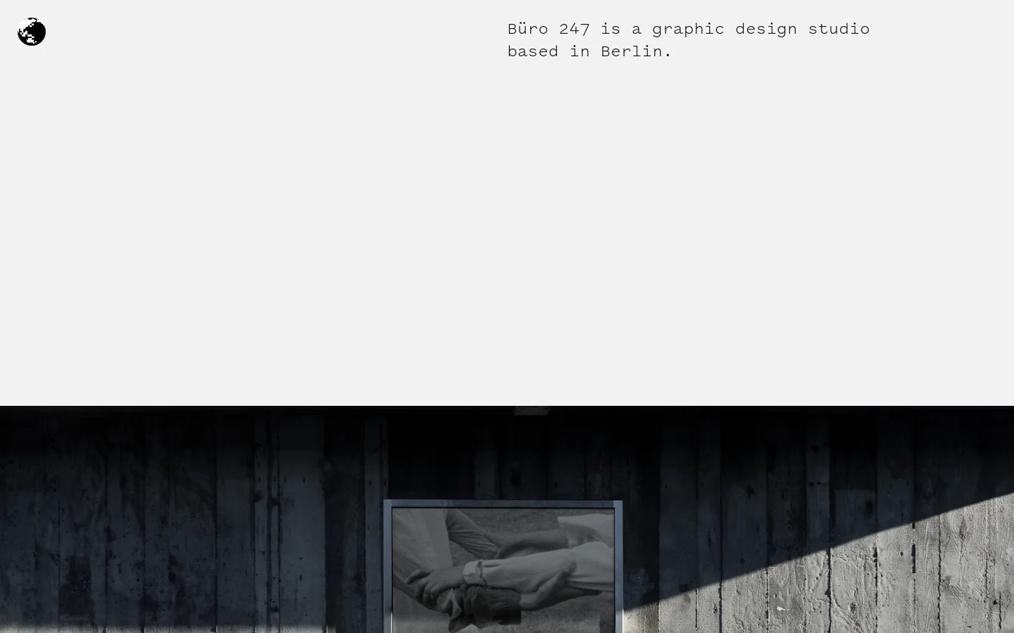 The desktop homepage features a minimalist design with a light grey background and black monospaced text. A small black globe icon is in the top left, and the text 'Büro 247 is a graphic design studio based in Berlin' is positioned in the top right. Below, a large project showcase displays a poster for 'Turtleneck Phantasies' framed against a dark, textured wooden wall.