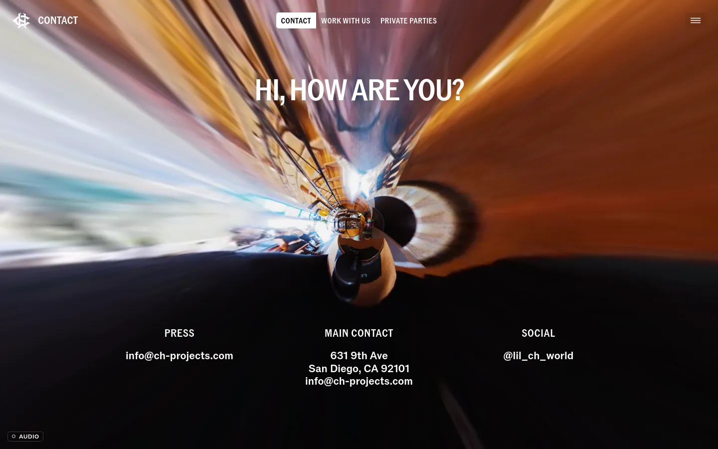 The desktop contact page features a large, distorted fisheye-lens hero image with warm tones and a central headline reading 'HI, HOW ARE YOU?'. A navigation bar at the top includes links for Contact, Work With Us, and Private Parties. Below the hero image, contact information is organized into three columns for Press, Main Contact, and Social.