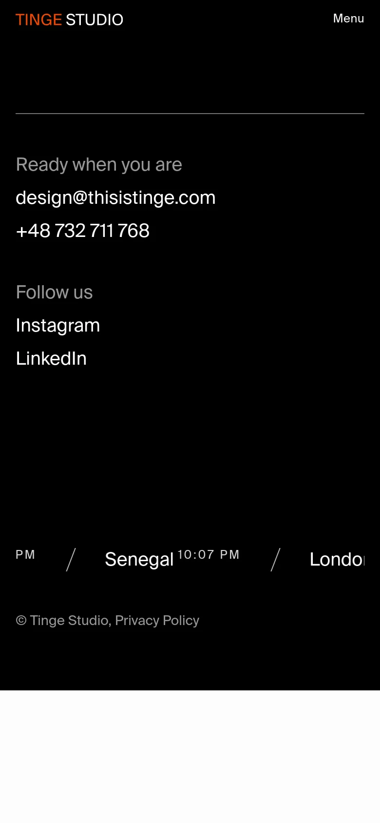 The mobile version maintains the black and white minimalist theme but uses a vertical single-column layout. The text and contact links are stacked vertically for easier scrolling, and the footer information is condensed to fit the narrow screen width.