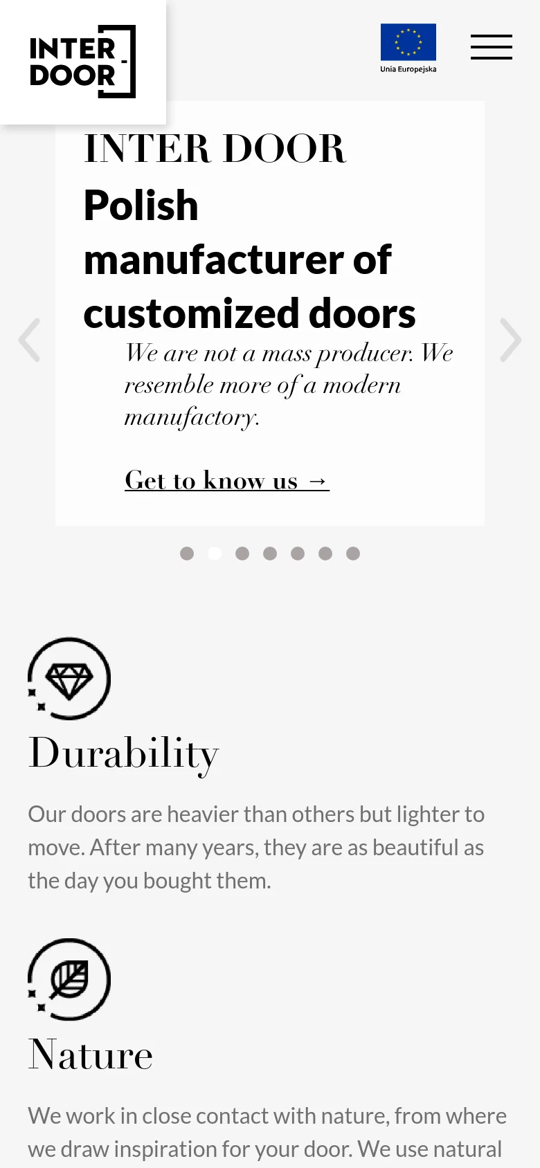 The mobile version simplifies the layout, replacing the wide navigation bar with a hamburger menu icon next to the Inter Door logo. The hero section maintains the large serif typography and call to action, but the content is vertically stacked to fit the narrow screen. The background remains a clean, dominant white with black text and minimal decorative elements.