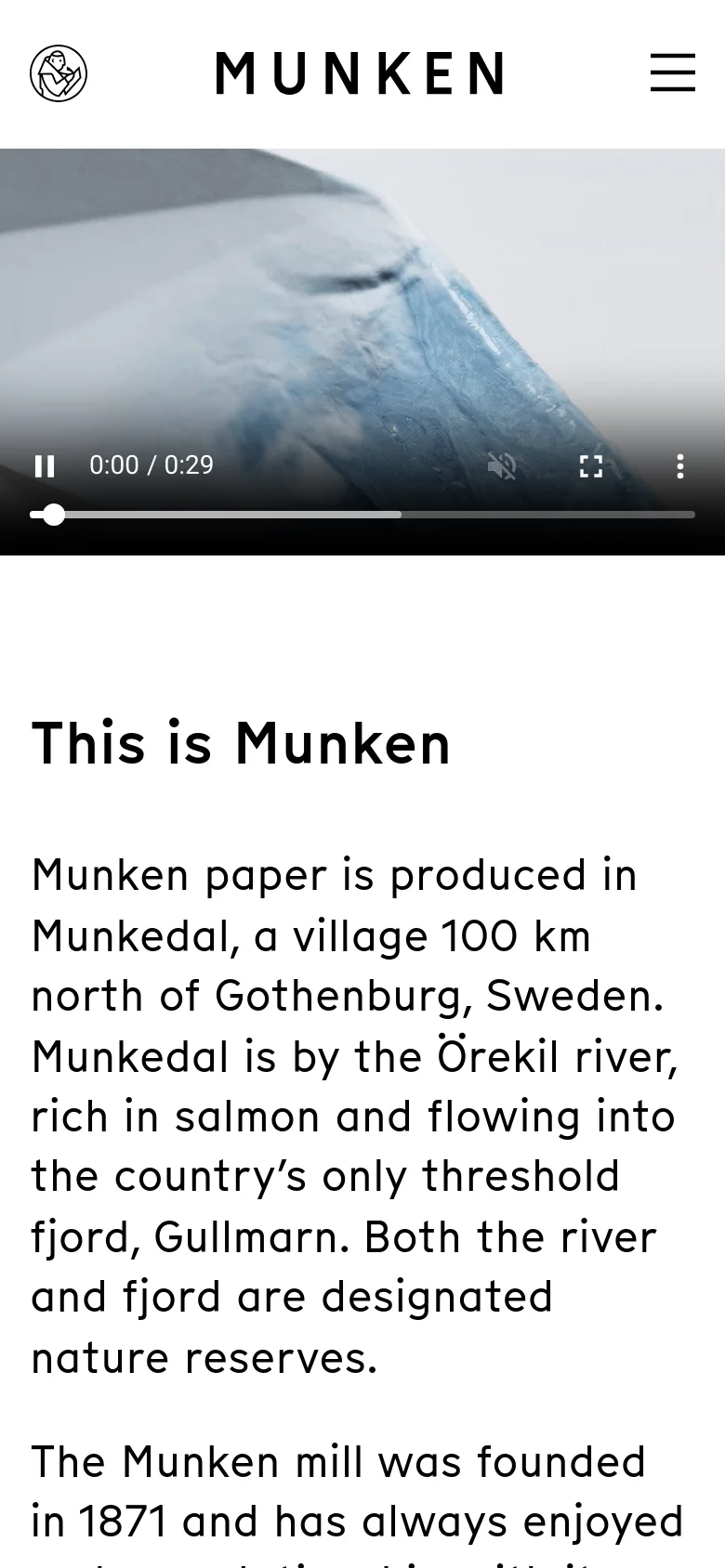 The mobile version maintains the clean white aesthetic but stacks the content vertically. The hero video remains at the top, followed by the 'This is Munken' headline and body text, with a simplified navigation menu represented by a hamburger icon in the top right corner.
