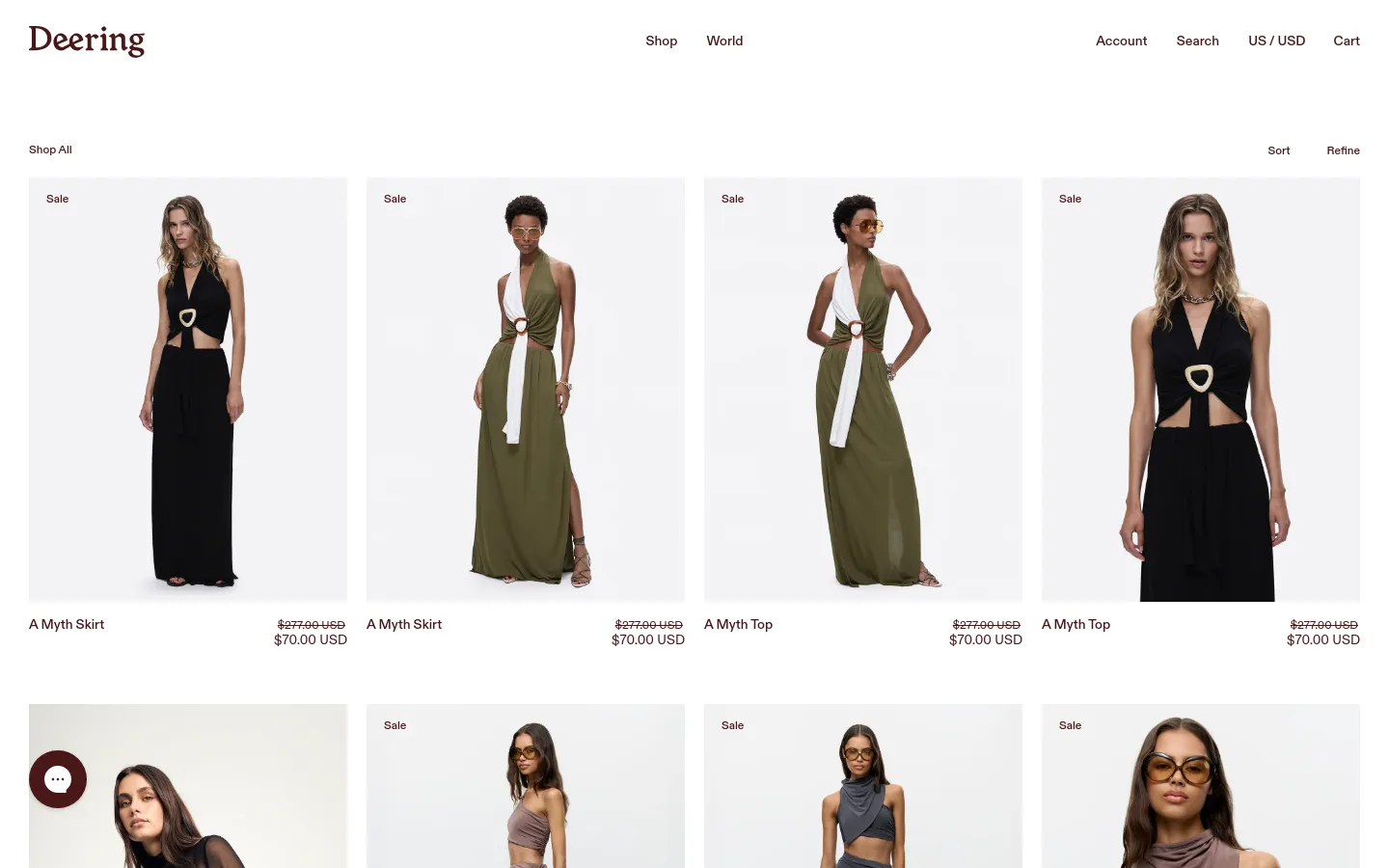 The desktop shop page features a clean white background with a grid of fashion product images. A top navigation bar includes the Deering logo, links for Shop and World, and utility links for Account, Search, Currency, and Cart. Below the header, a 'Shop All' heading is followed by 'Sort' and 'Refine' options, with product cards displaying high-quality photography of models in skirts and tops, accompanied by product names and sale prices.