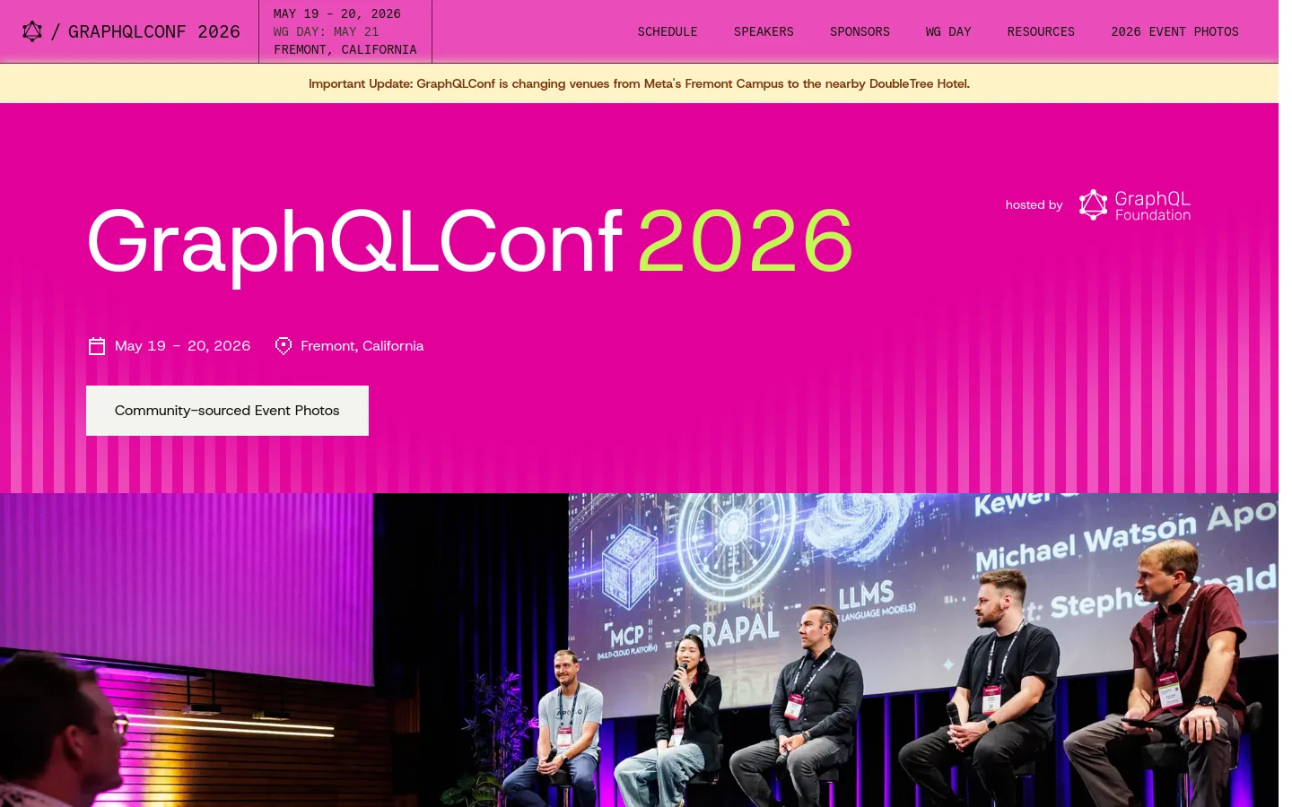 The GraphQLConf 2026 homepage features a vibrant magenta hero section with large white and lime green text. A navigation bar at the top includes links for Schedule, Speakers, and Sponsors, while a banner below highlights a venue change. A large photograph below the hero section shows five speakers on a stage during a previous conference.