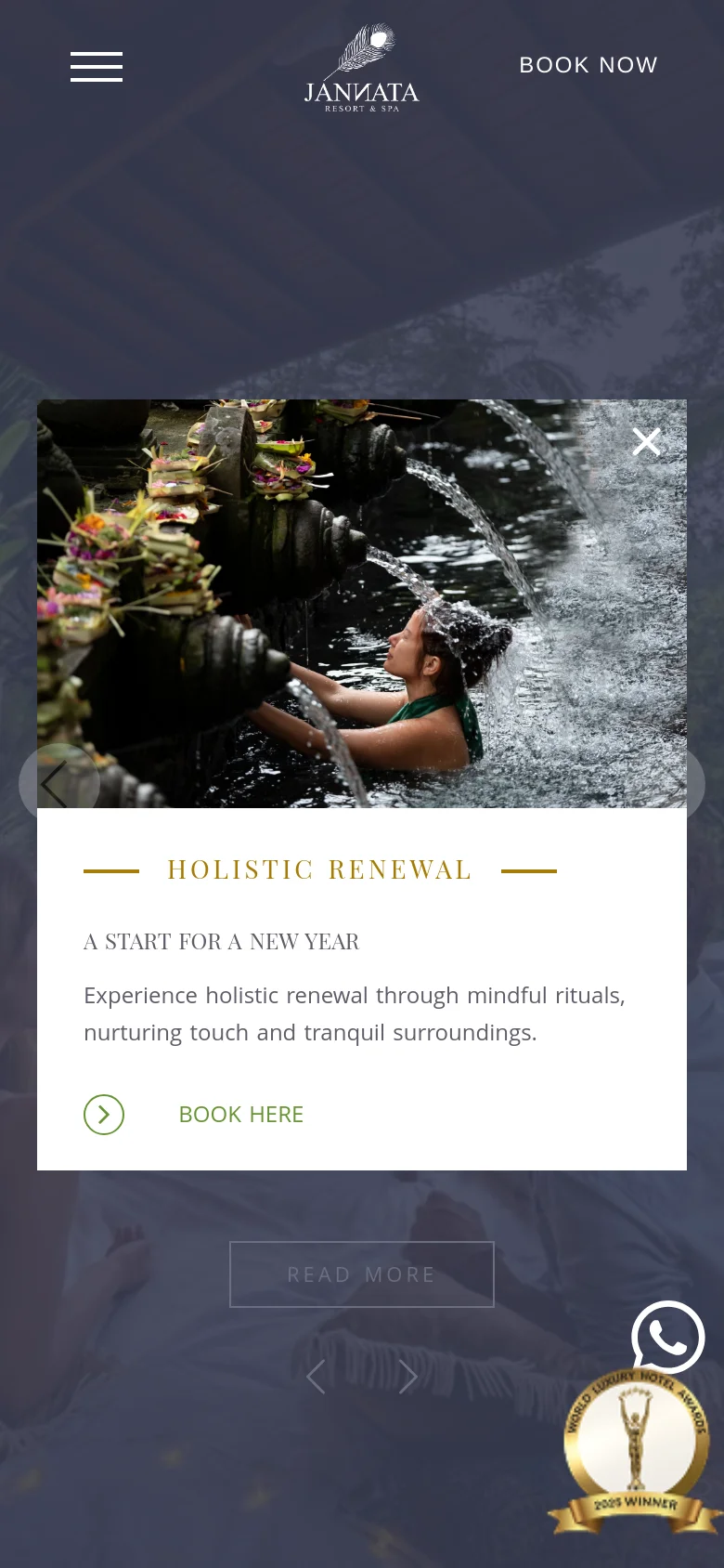 The mobile version displays a condensed layout with a hamburger menu icon and the Jannata logo centered at the top. The hero image is partially obscured by a large, centered pop-up promoting 'Holistic Renewal' featuring a woman under flowing water. A 'Book Now' button is prominent, and a WhatsApp icon and award badge are visible at the bottom right.
