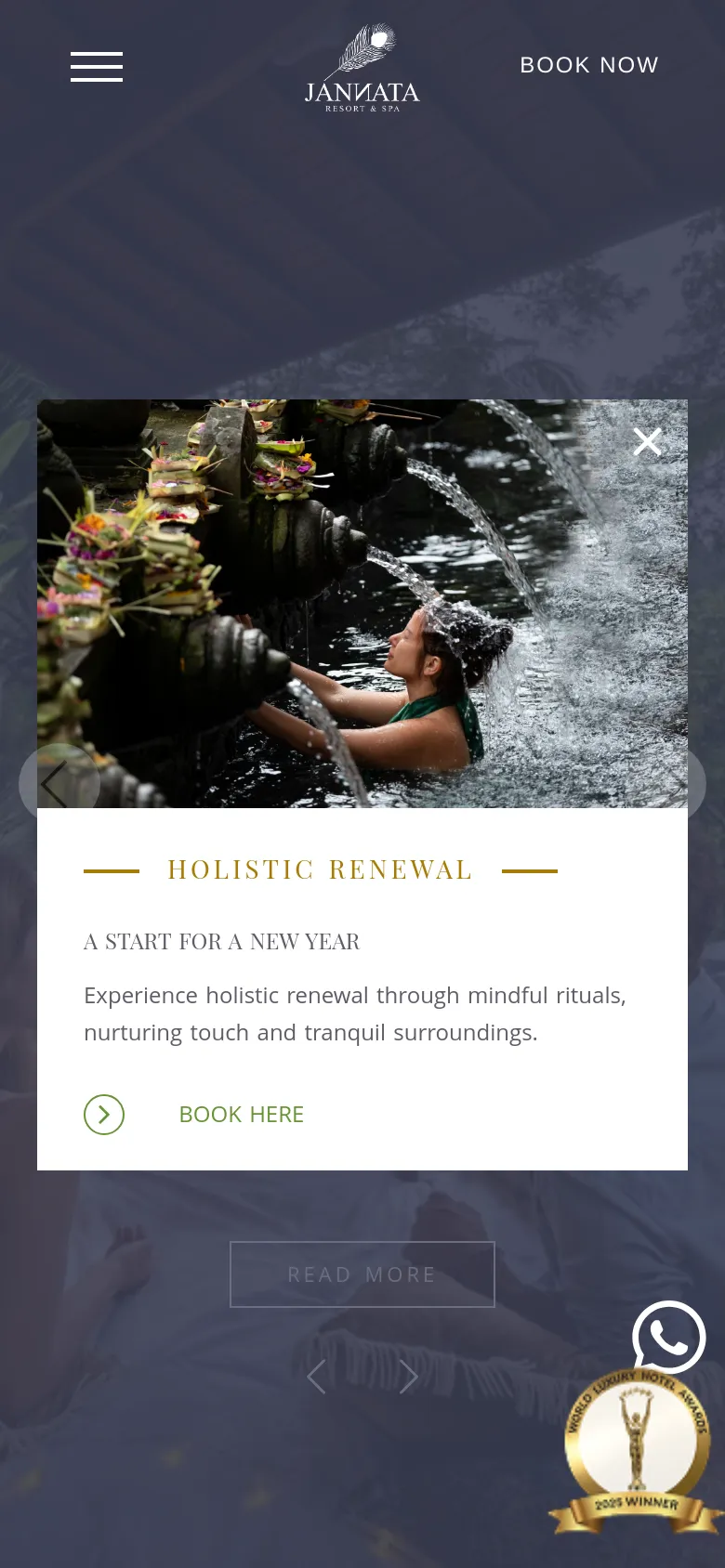The mobile version displays a condensed layout with a hamburger menu icon and the Jannata logo centered at the top. The hero image is partially obscured by a large, centered pop-up promoting 'Holistic Renewal' featuring a woman under flowing water. A 'Book Now' button is prominent, and a WhatsApp icon and award badge are visible at the bottom right.