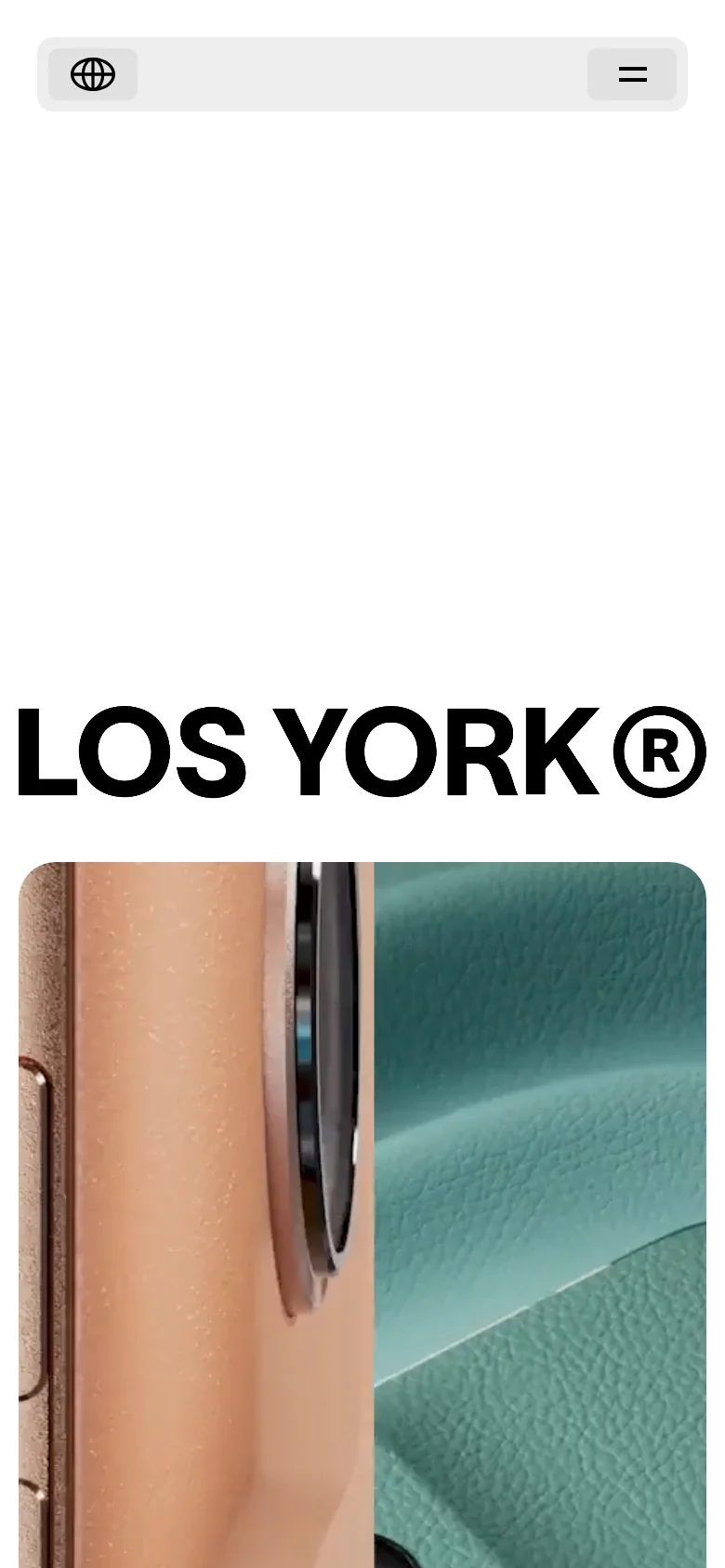 The mobile version maintains the minimalist white aesthetic and the large 'LOS YORK ®' headline. The top navigation is condensed into a light gray bar containing a globe icon on the left and a hamburger menu icon on the right. The video content remains the primary visual element below the header.