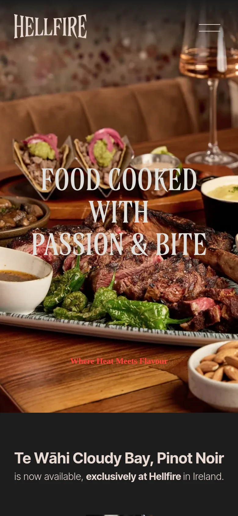 The mobile version presents a vertically stacked layout starting with a full-width hero image of food and the headline 'FOOD COOKED WITH PASSION & BITE'. The navigation is condensed into a hamburger menu icon in the top right, and the 'Book Now' button is prominently displayed. The content flows downward with large, high-quality images of grilled meats and seafood, optimized for vertical scrolling.