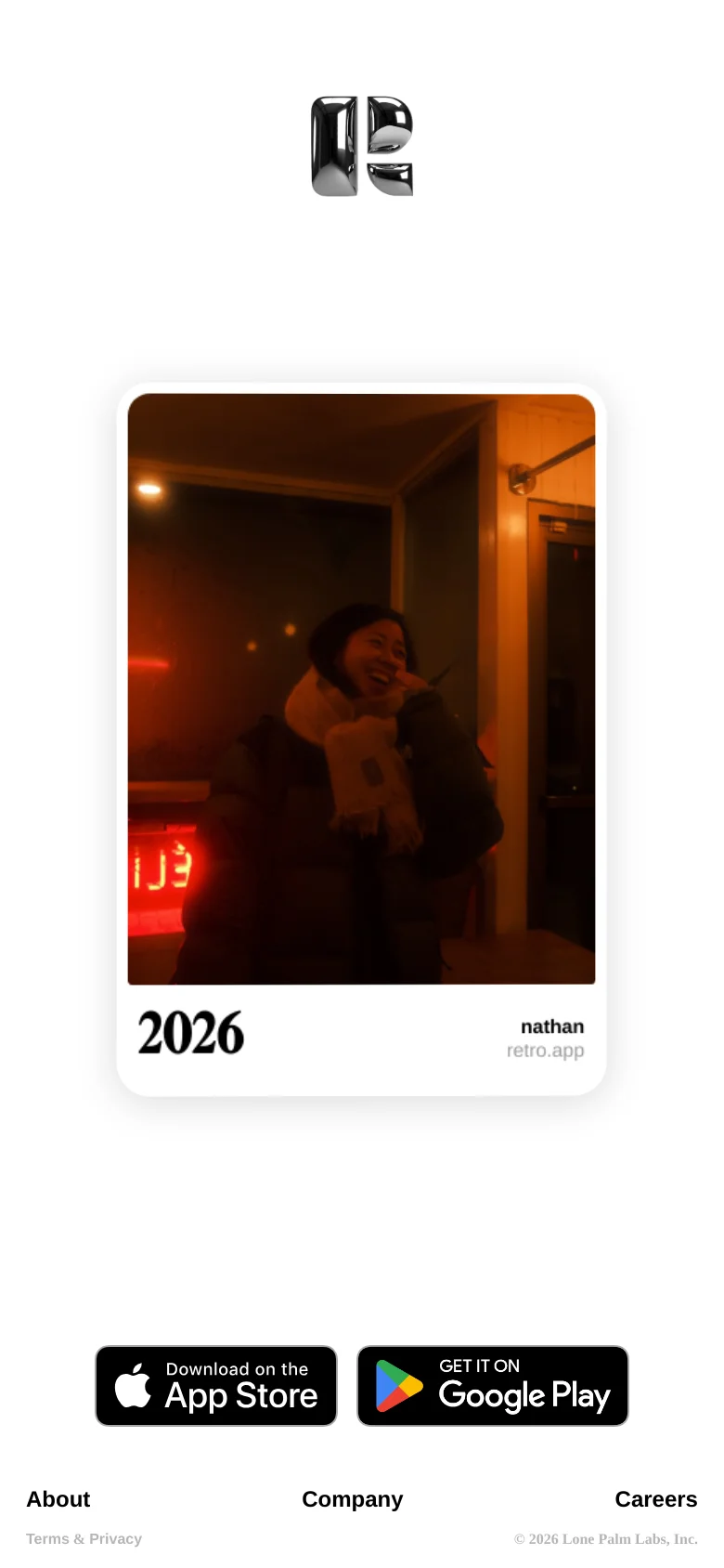 The mobile version presents a vertically stacked layout with a single, large lifestyle photo occupying the center of the screen. Below the image, the year '2026' and the username 'nathan' are displayed in bold black text. The footer is simplified, placing the App Store and Google Play download buttons prominently above the navigation links.