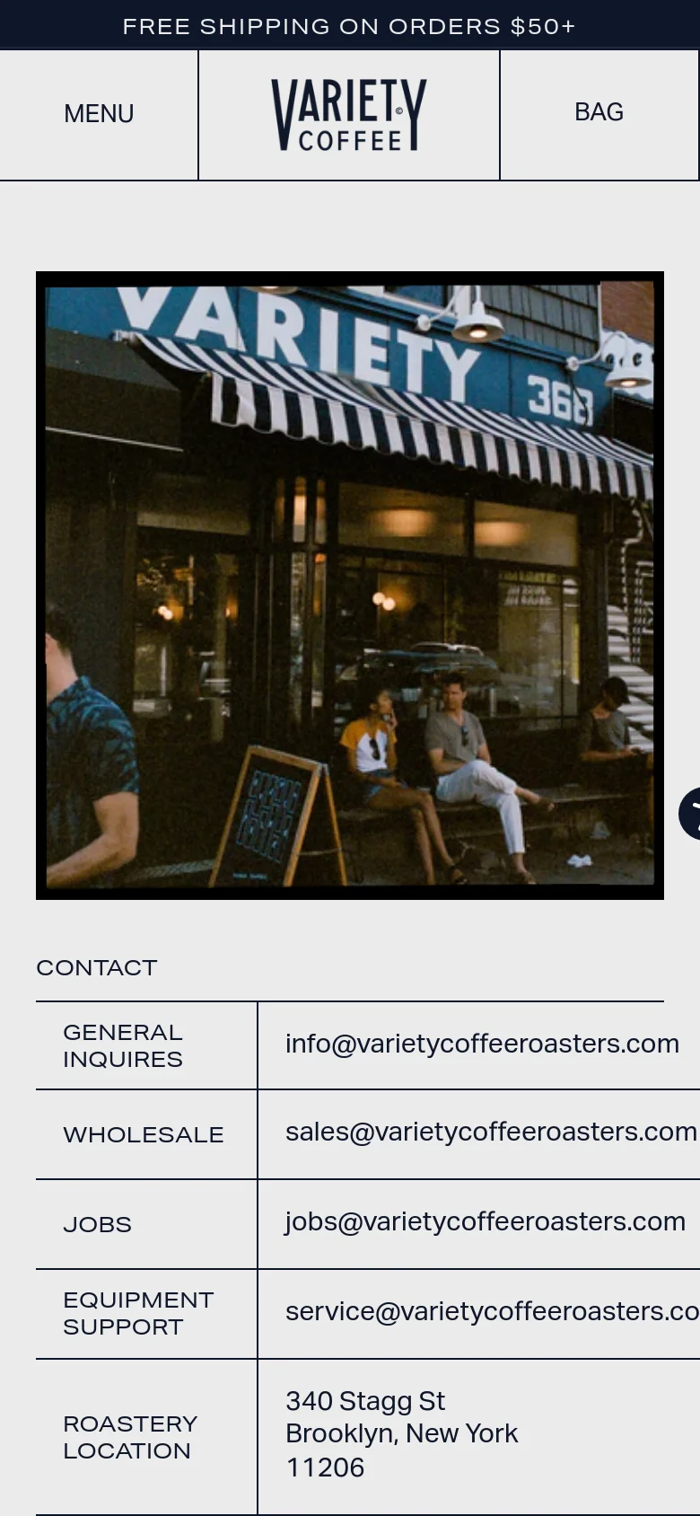 Variety Coffee contact page on mobile with a stacked layout. A large photo of the cafe storefront sits above a vertical list of contact sections including General Inquiries, Wholesale, and Roastery Location details on a cream background.