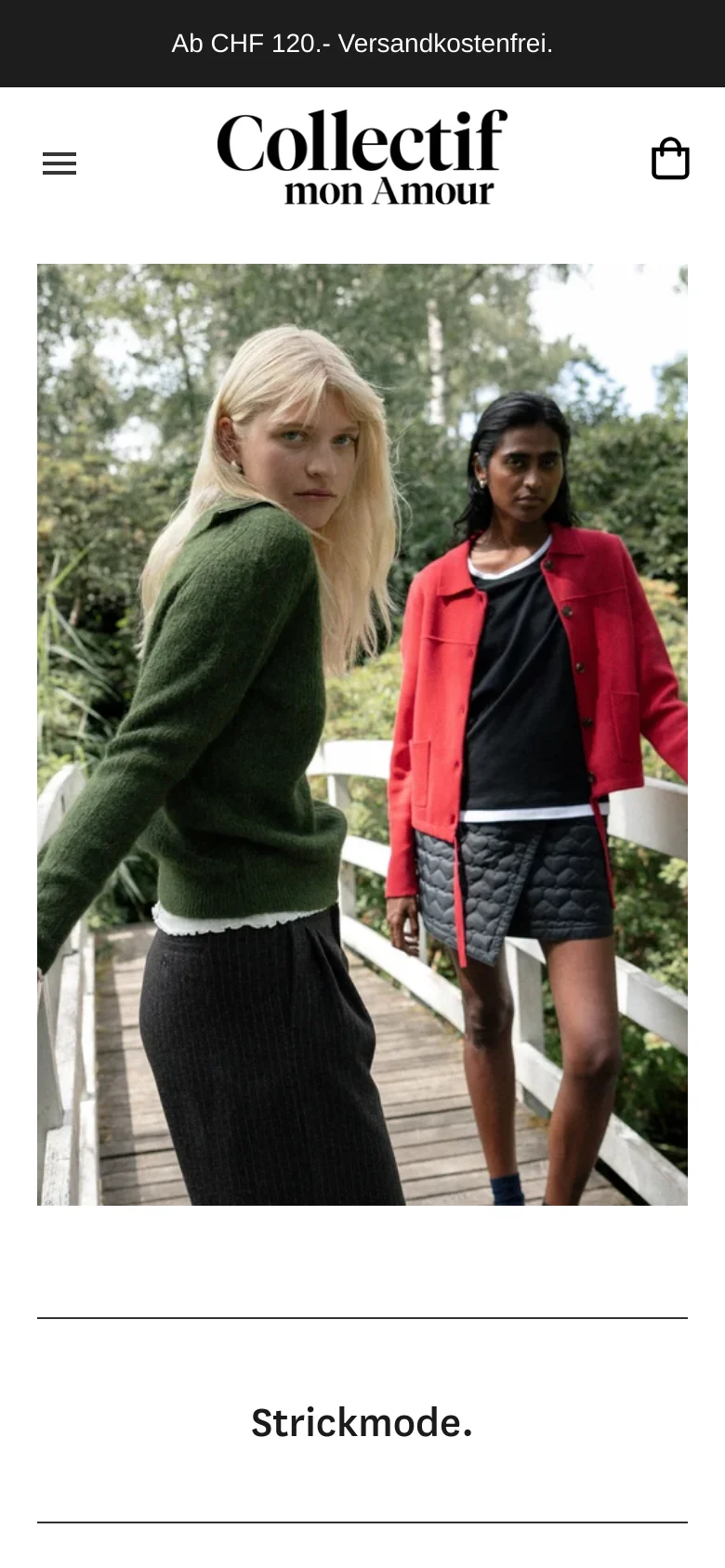 The mobile version presents a simplified layout with a centered brand logo and a hamburger menu on the left, while the shopping bag icon is on the right. The large hero image of two models in a garden remains the focal point, followed by the 'Strickmode.' heading. The top black banner provides shipping information, and the overall design is vertically stacked for easy scrolling.