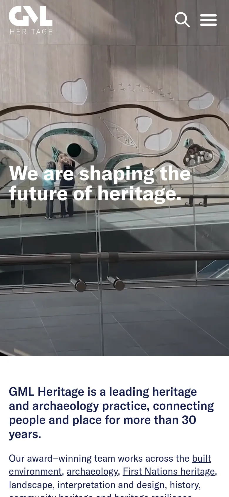 Mobile version of the homepage with a condensed layout. The hero image shows a modern architectural glass structure with the same headline overlaid in white. The navigation is simplified into a search icon and a hamburger menu icon at the top right, while the introductory text follows below the hero image.