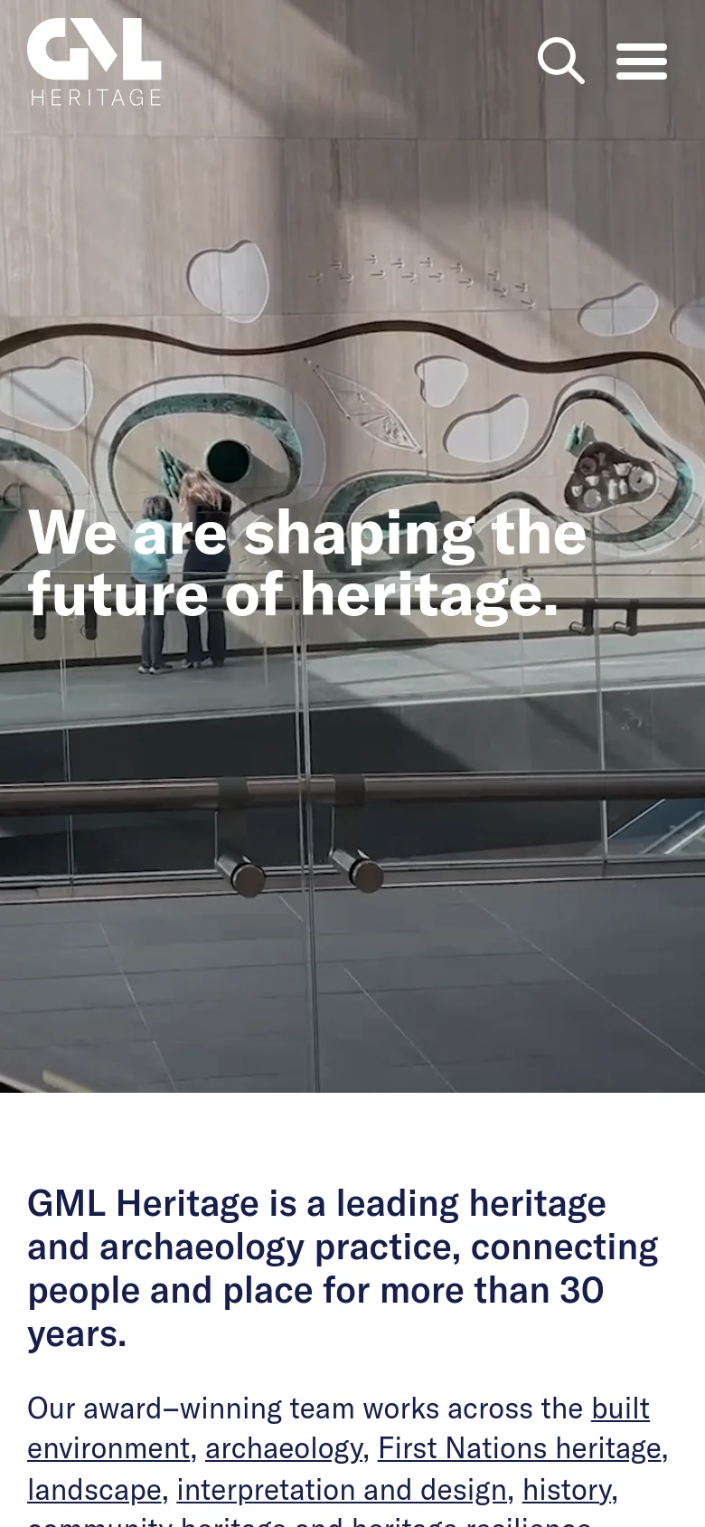 Mobile version of the homepage with a condensed layout. The hero image shows a modern architectural glass structure with the same headline overlaid in white. The navigation is simplified into a search icon and a hamburger menu icon at the top right, while the introductory text follows below the hero image.