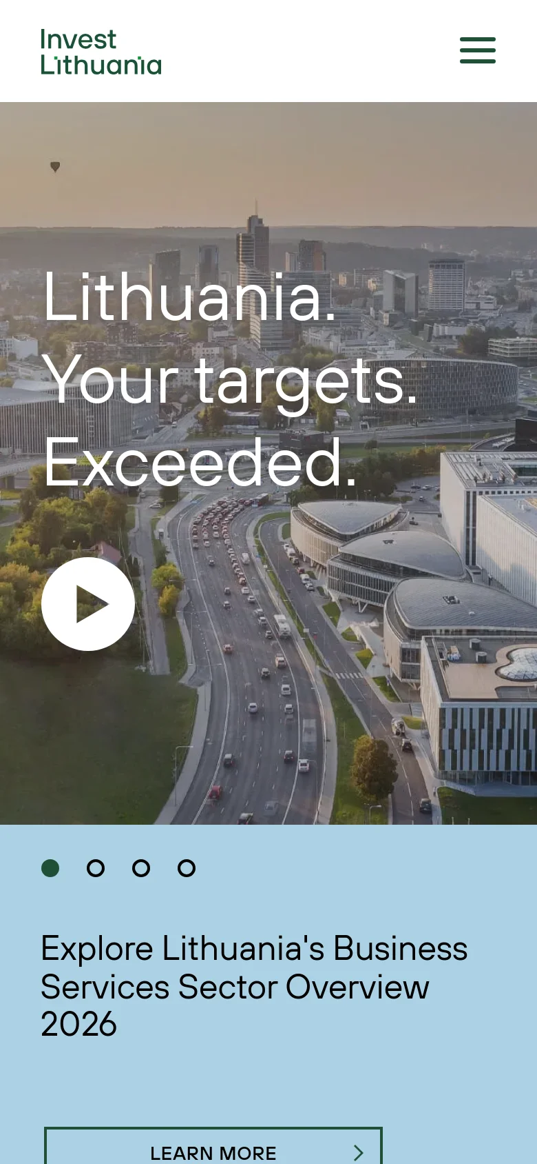 The mobile version shows a simplified layout with a hamburger menu icon at the top right and the Invest Lithuania logo on the left. The hero section features the same cityscape and headline, but the content is stacked vertically, showing the headline and play button above a large, full-width light blue section containing the report title and a 'Learn More' button.