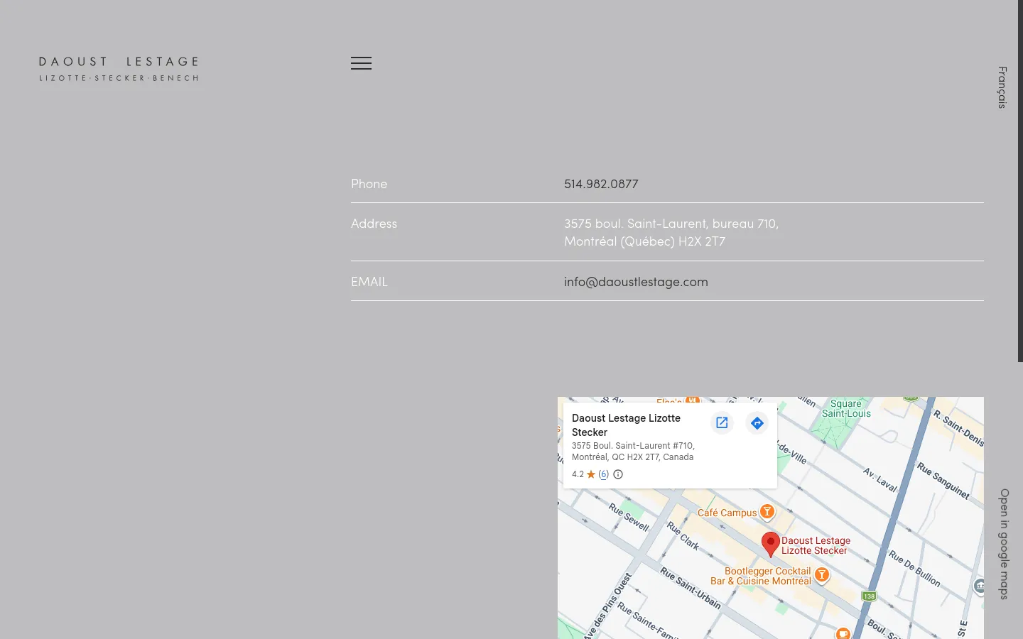 The desktop contact page features a minimalist design with a light gray background and white text. Contact details including phone, address, and email are listed vertically on the left, while a large embedded Google Map showing the office location occupies the bottom right corner. The company logo is positioned in the top left corner.