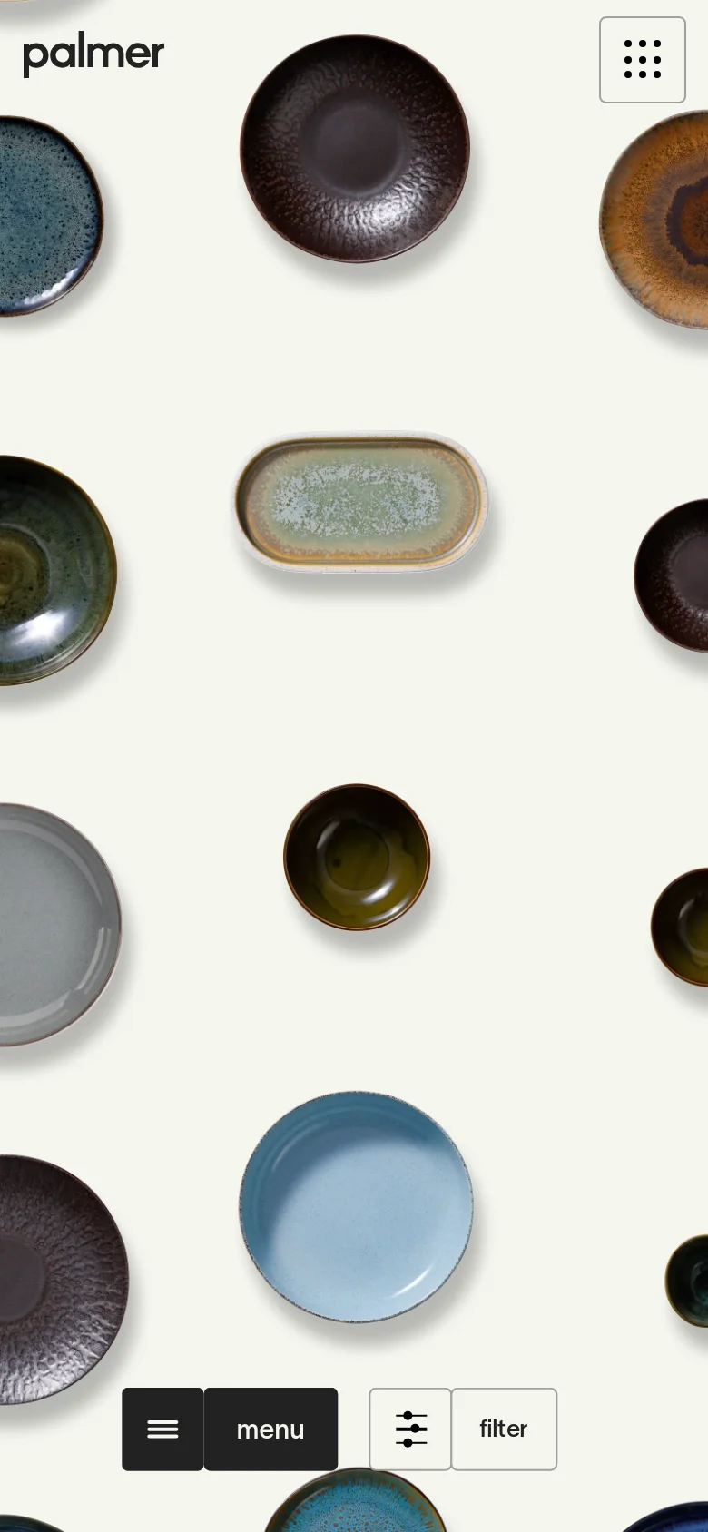 The mobile version presents a denser, vertically oriented view of the ceramic dinnerware collection against a cream background. The 'menu' and 'filter' buttons are enlarged and positioned at the bottom for easy thumb access, and the scattered plate layout is optimized for a portrait screen.