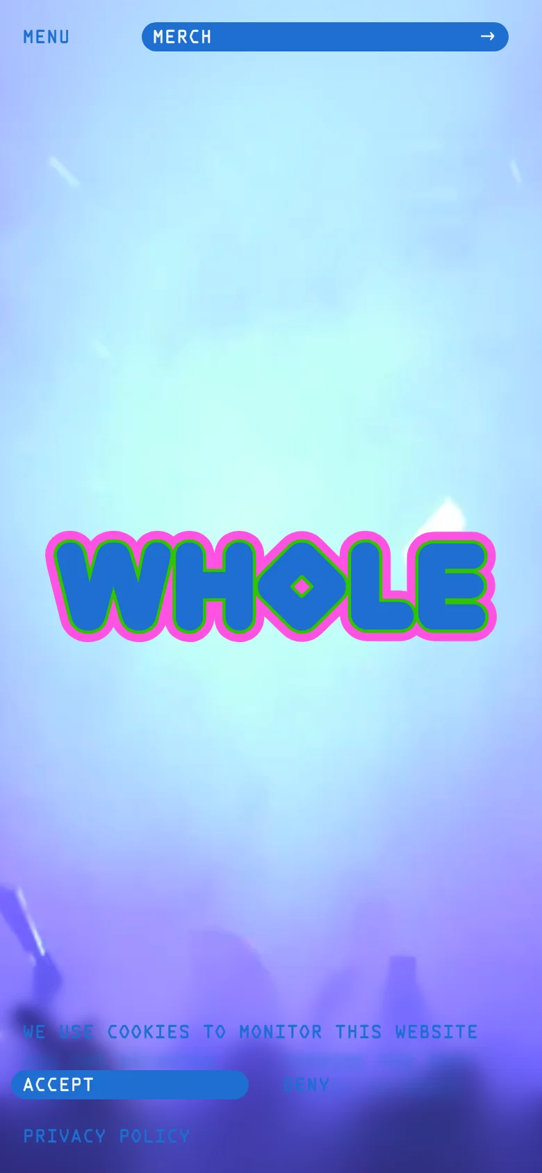 The mobile version presents a vertically oriented view of the festival homepage with the large 'WHOLE' logo centered against a light blue and purple gradient background. The top navigation is simplified with a 'MENU' button on the left and a 'MERCH' bar on the right. A cookie consent banner with 'ACCEPT' and 'DENY' buttons is fixed at the bottom of the screen.