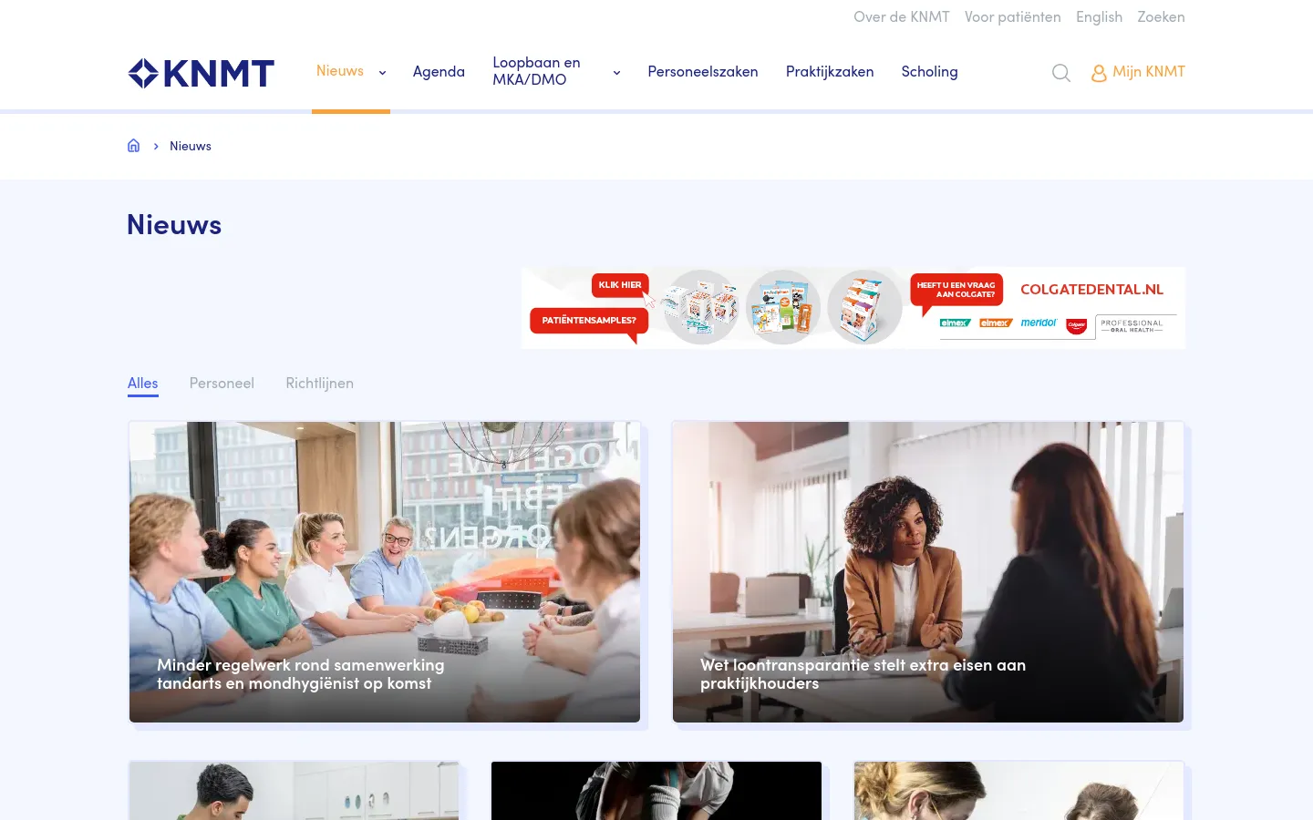 The news page features a white background with a blue and orange KNMT header. A horizontal banner advertisement sits below the 'Nieuws' title, followed by a category filter menu with options like 'Alles' and 'Personeel'. The main content consists of a grid of large news cards, each featuring a high-quality photograph with white headline text overlaid on the bottom.