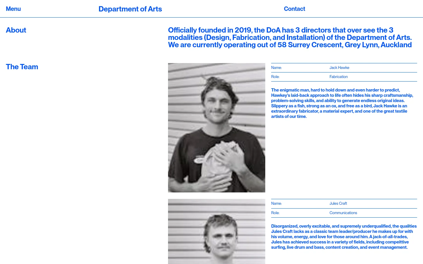 The About page features a clean white background with blue text. A header contains the navigation links 'Menu', 'Department of Arts', and 'Contact'. The main content includes an introductory paragraph about the company followed by 'The Team' section, which displays black and white portraits of team members alongside their names, roles, and biographies in a two-column layout.