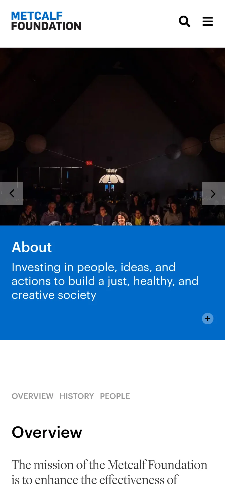 The mobile version presents a condensed view with a large hero image of a theater audience and a blue mission statement banner. The top navigation is replaced by a hamburger menu and a search icon, and the section navigation (Overview, History, People) is displayed as plain text below the hero section.