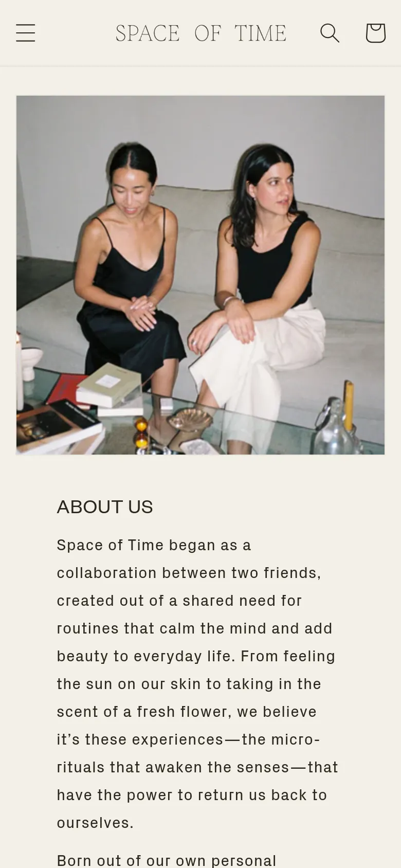 The mobile version presents a single-column vertical layout, starting with a large hero image of the two women. The 'ABOUT US' headline and text follow below the image, and the navigation is condensed into a hamburger menu at the top left, maintaining the brand's clean, neutral aesthetic.