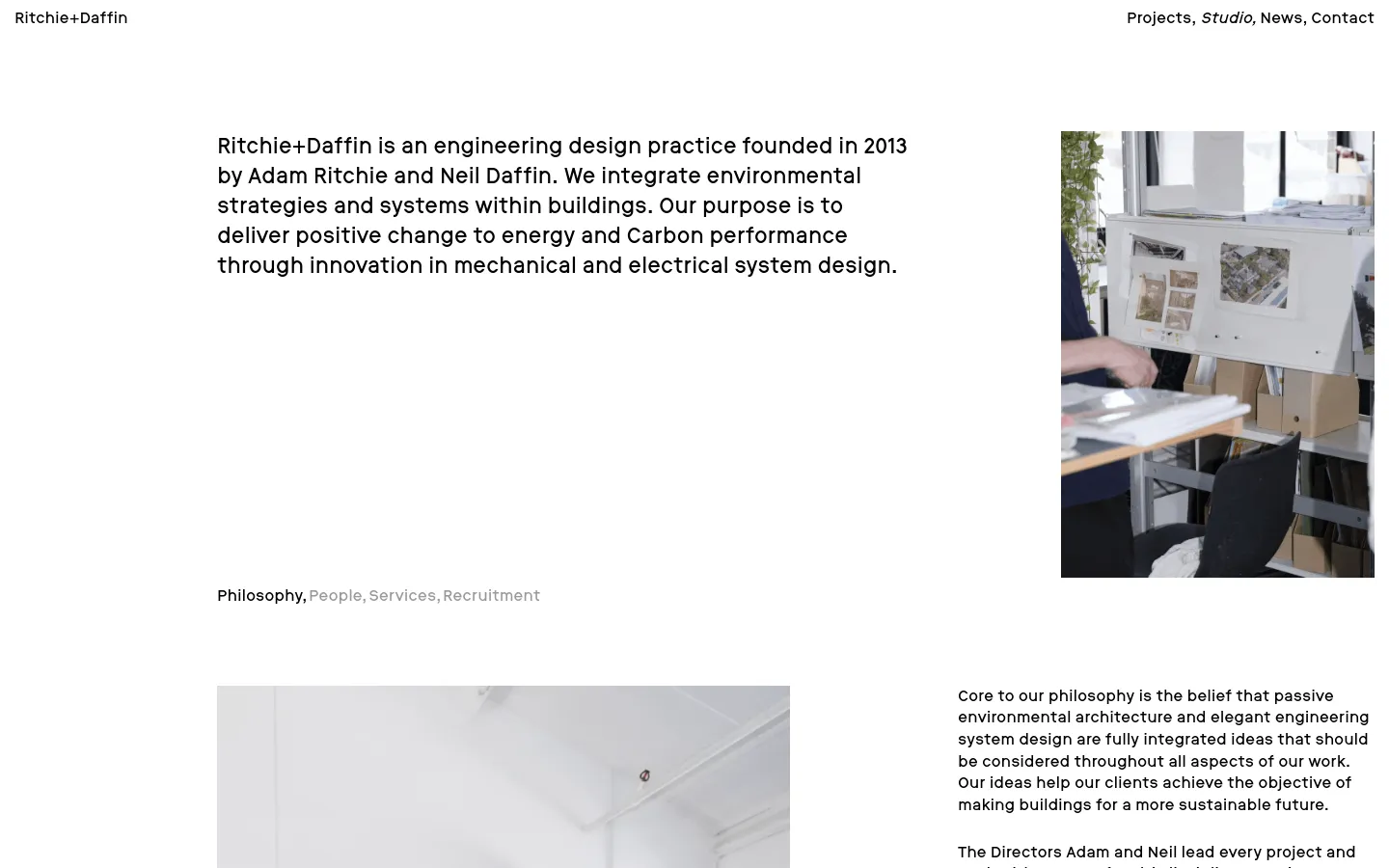 The Studio page features a clean, minimalist layout with black text on a white background. A large text block introduces the engineering practice on the left, paired with a vertical rectangular photograph of a studio workspace on the right. Navigation links for Projects, Studio, News, and Contact are located at the top right.
