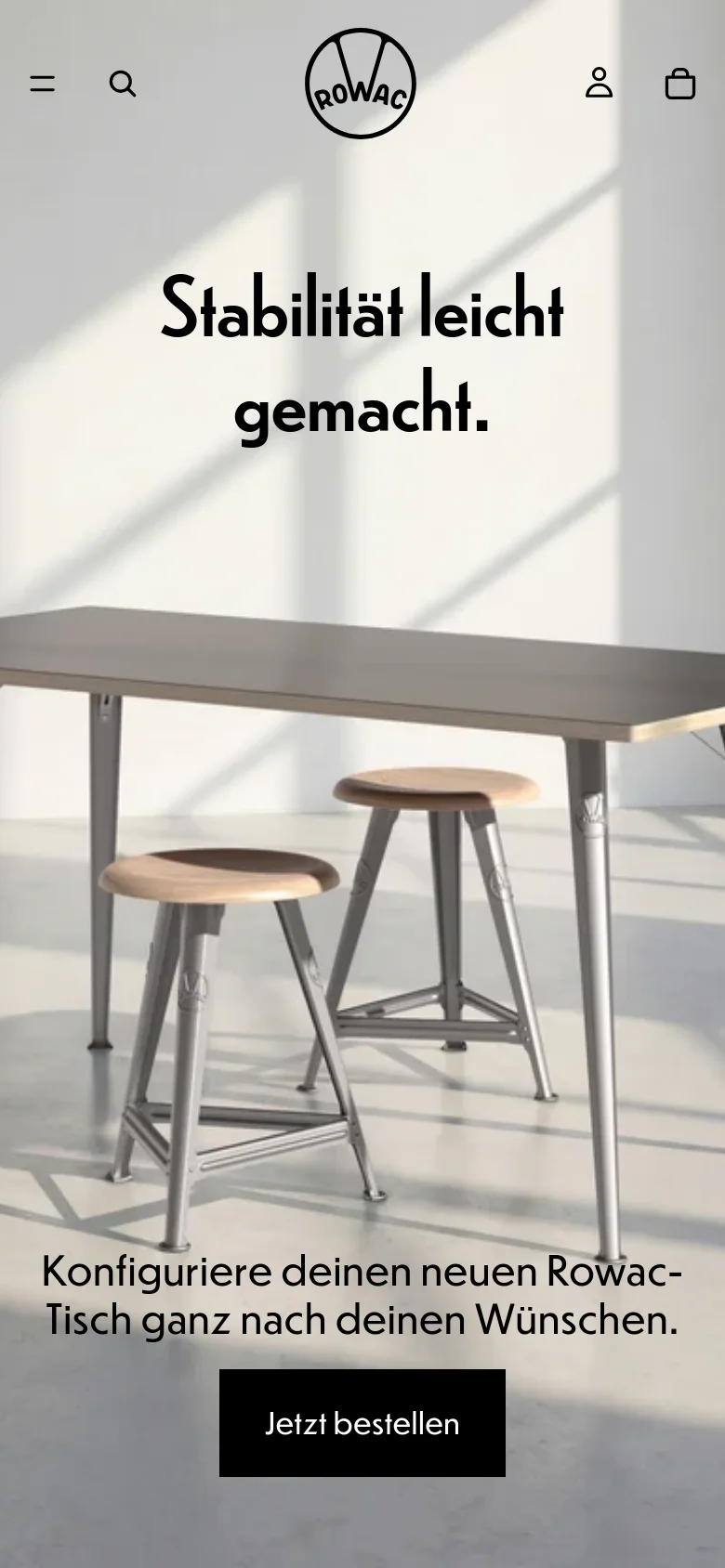 The mobile version presents a vertically stacked layout optimized for small screens, starting with a centered ROWAC logo and a hamburger menu icon. The hero section features the same sunlit furniture imagery but with the headline 'Stabilität leicht gemacht.' and a black 'Jetzt bestellen' button positioned lower on the screen. The navigation is condensed into a top bar with a search icon, user icon, and shopping bag icon.