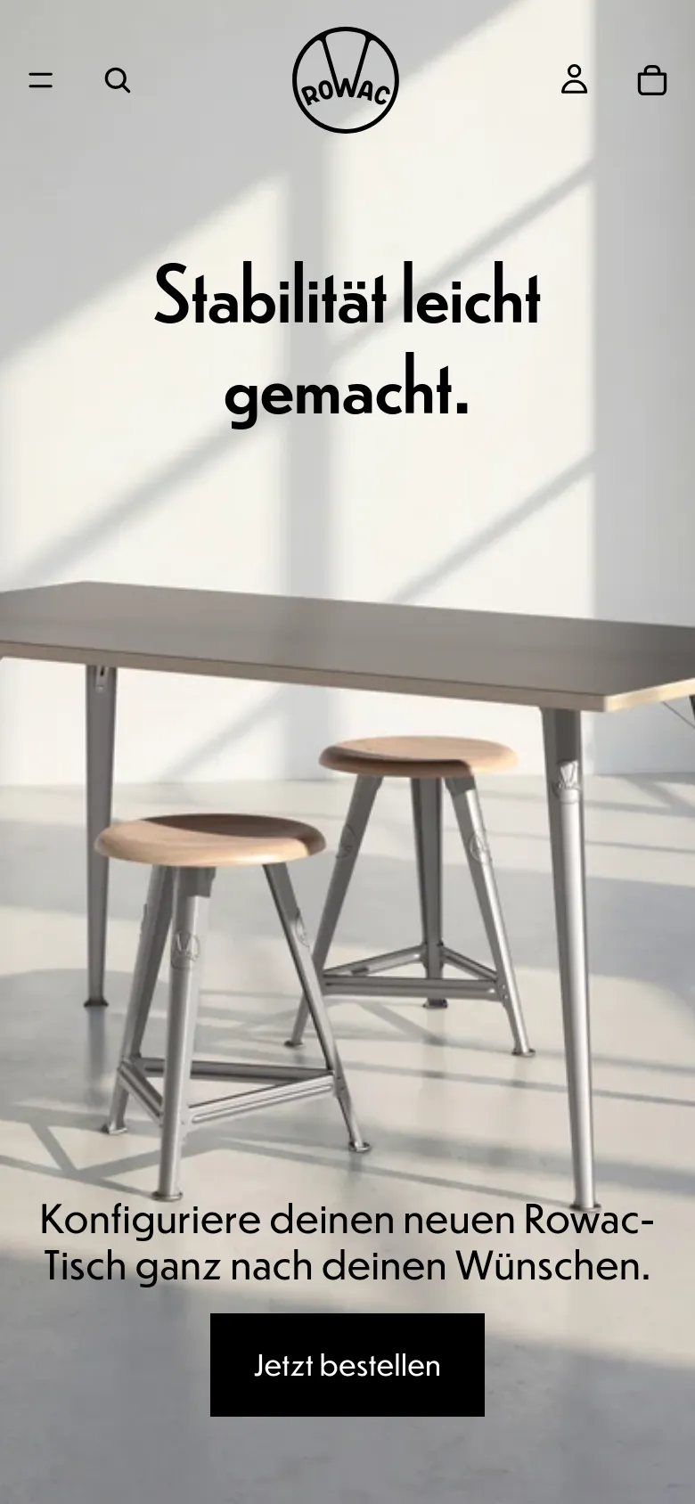 The mobile version presents a vertically stacked layout optimized for small screens, starting with a centered ROWAC logo and a hamburger menu icon. The hero section features the same sunlit furniture imagery but with the headline 'Stabilität leicht gemacht.' and a black 'Jetzt bestellen' button positioned lower on the screen. The navigation is condensed into a top bar with a search icon, user icon, and shopping bag icon.
