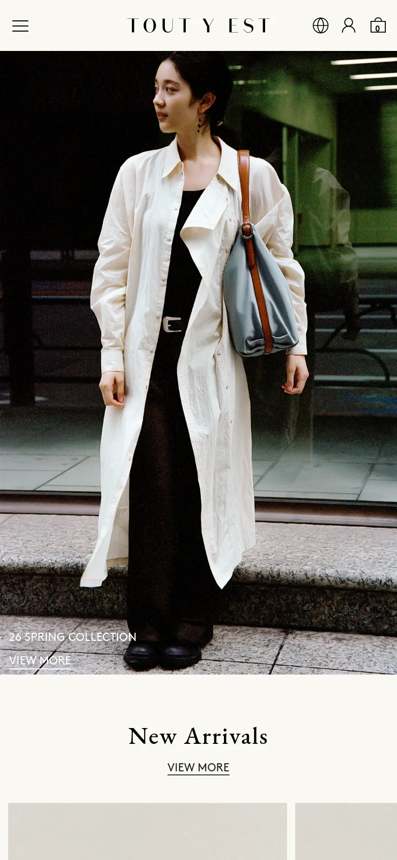 The mobile version presents a vertically stacked layout, starting with a hamburger menu and the brand logo at the top. The hero image of the woman is scaled to fit the screen width, with the '26 Spring Collection' text and 'View More' call to action overlaid at the bottom. The 'New Arrivals' section follows below, optimized for single-column scrolling.