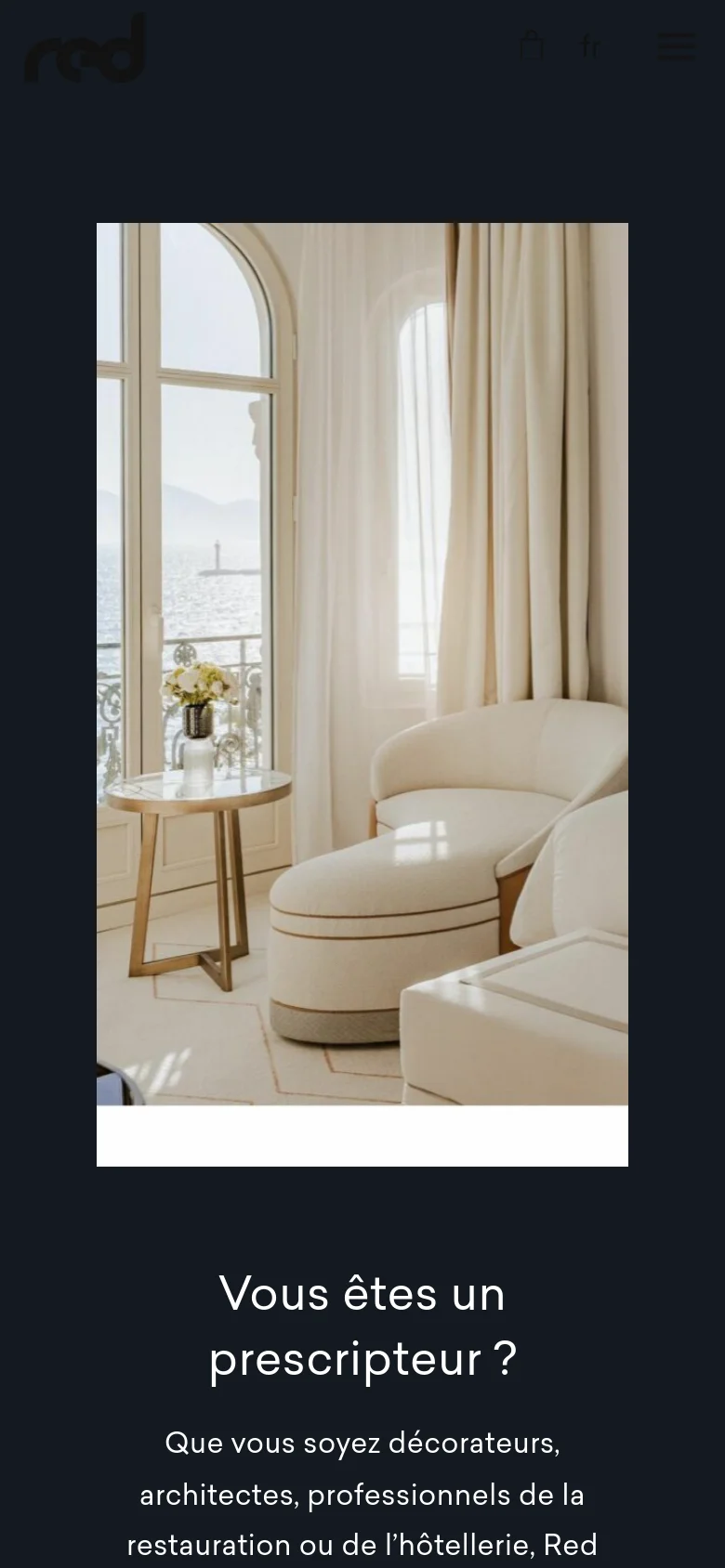 The mobile version uses a single-column layout with the large interior lifestyle image positioned at the top. The text sections follow vertically below the image, maintaining the dark background and white typography for readability on a smaller screen.
