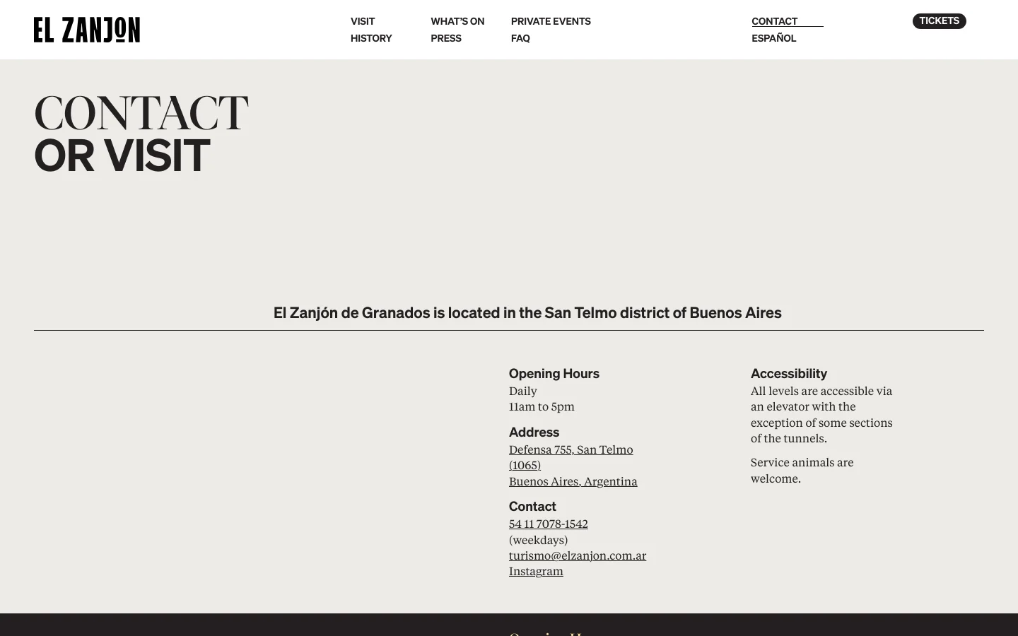 The desktop Contact page features a minimalist design with a large 'CONTACT OR VISIT' headline in dark serif font against a light beige background. Below a horizontal line, the text details opening hours, address, contact info, and accessibility in a multi-column layout. The navigation bar at the top includes links for Visit, What's On, Private Events, History, Press, FAQ, Contact, and Español, alongside a 'TICKETS' button.
