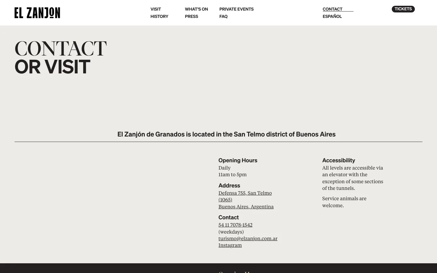 The desktop Contact page features a minimalist design with a large 'CONTACT OR VISIT' headline in dark serif font against a light beige background. Below a horizontal line, the text details opening hours, address, contact info, and accessibility in a multi-column layout. The navigation bar at the top includes links for Visit, What's On, Private Events, History, Press, FAQ, Contact, and Español, alongside a 'TICKETS' button.