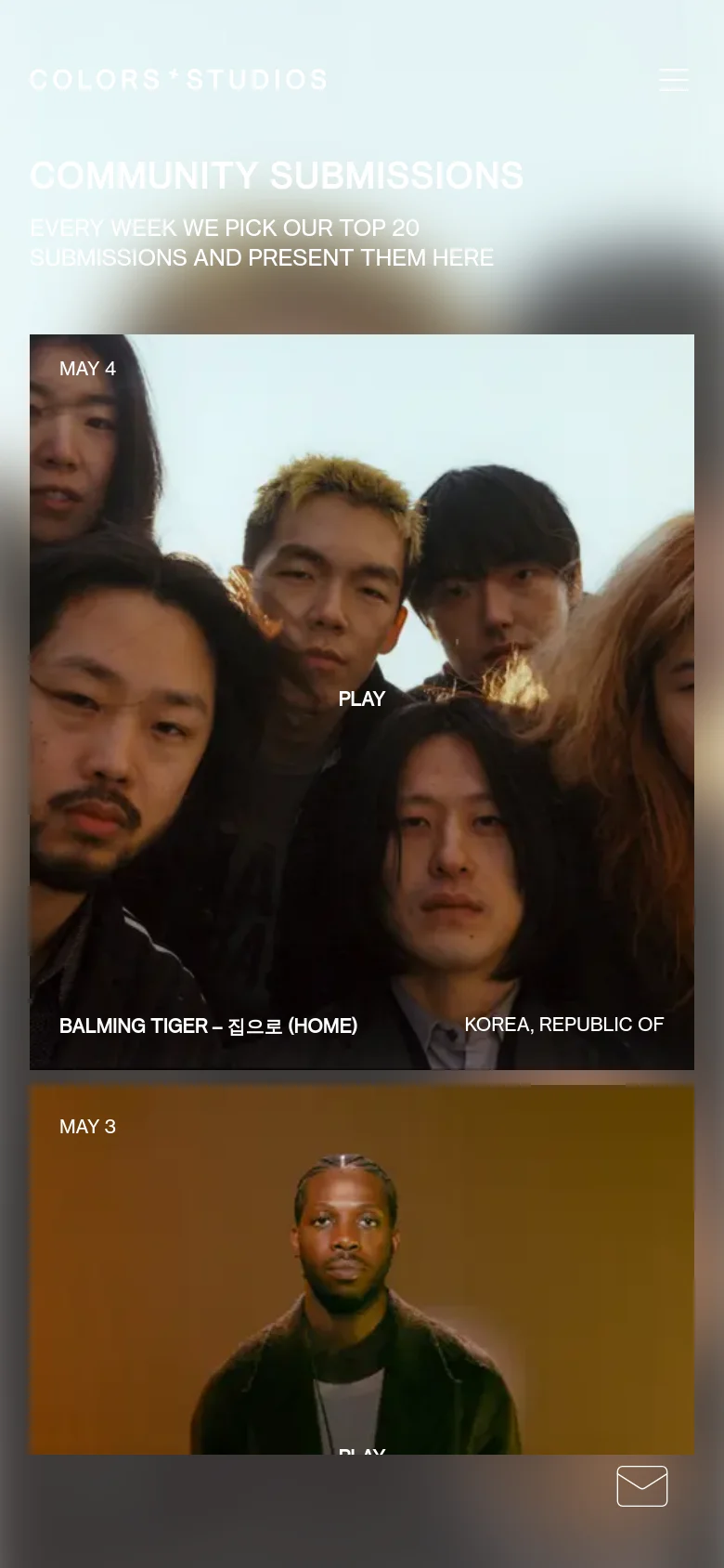 The mobile version presents a single-column vertical scroll of large, full-width music cards, each featuring an artist image, date, track details, and a 'PLAY' button. The navigation is condensed into a hamburger menu, and the layout maintains the dark aesthetic with high-contrast white text.